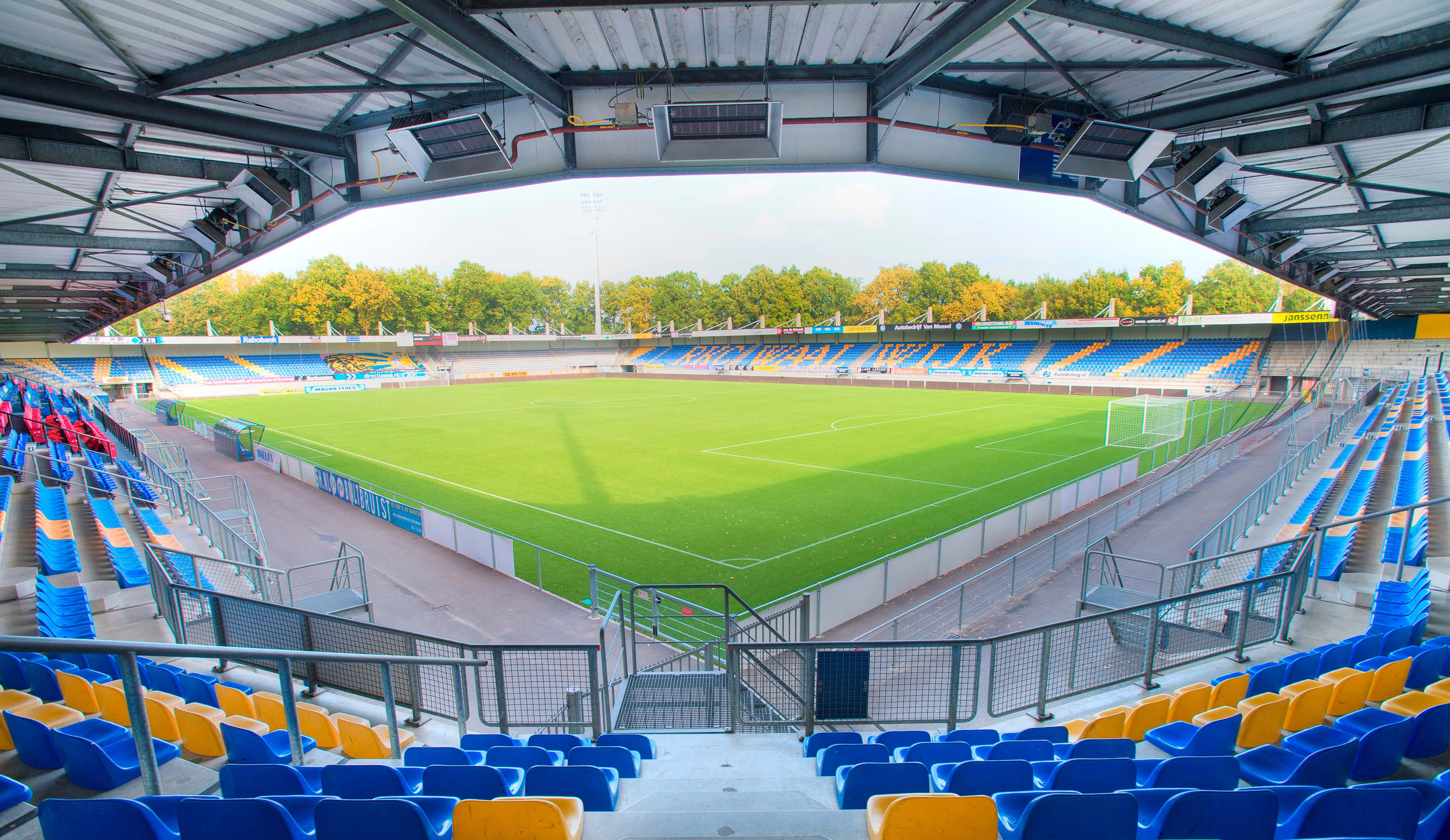 RKC Waalwijk, stadium interior view, vibrant blue and yellow seats, 4K Desktop Wallpaper