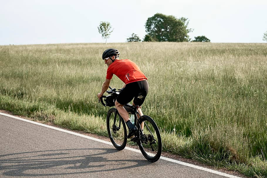 red jersey, sunlit rural road, tall grass, SD Desktop Wallpaper