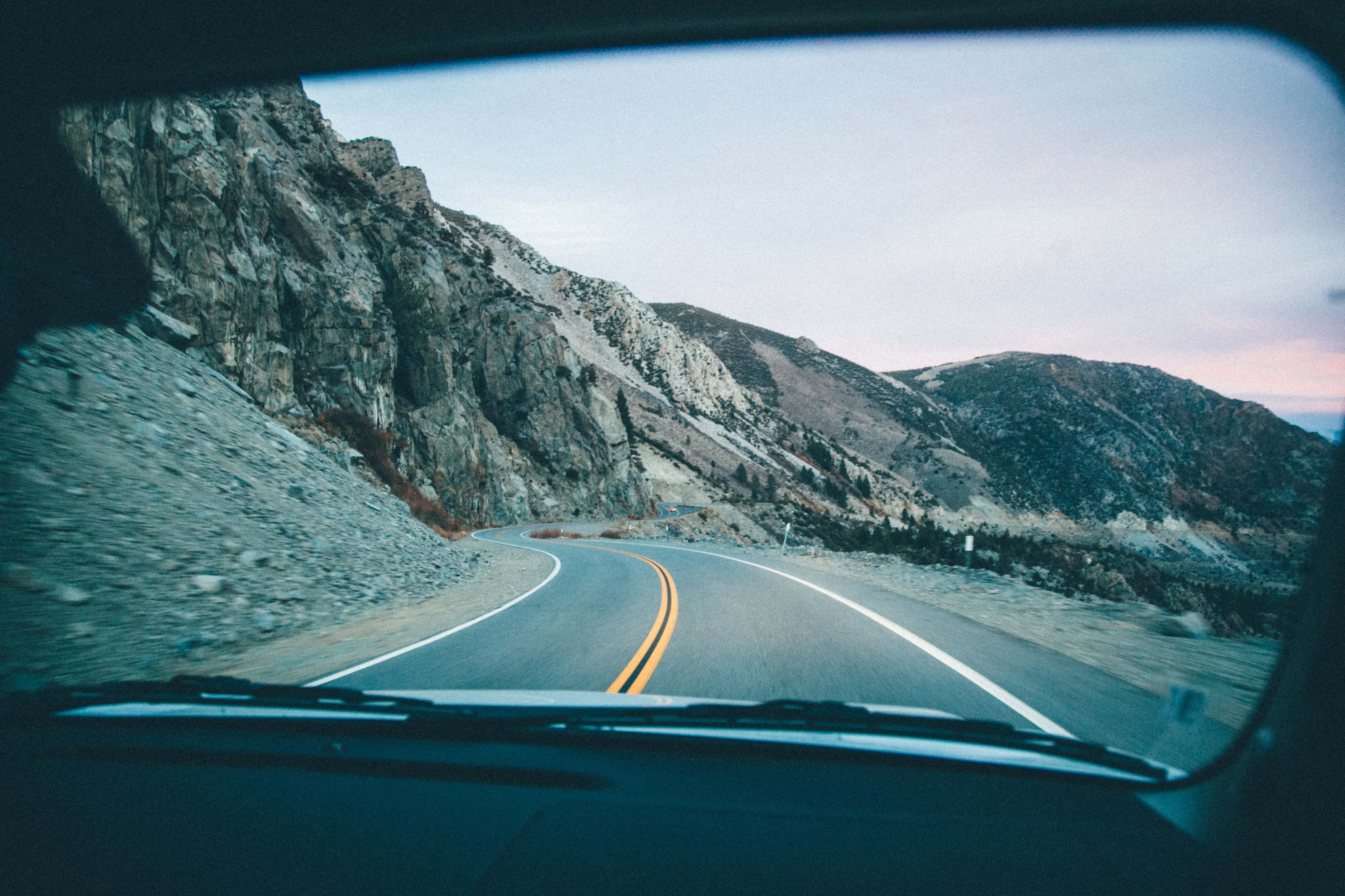 Scenic Road Trip Adventure, winding mountain road, rocky terrain, 4K Desktop Wallpaper