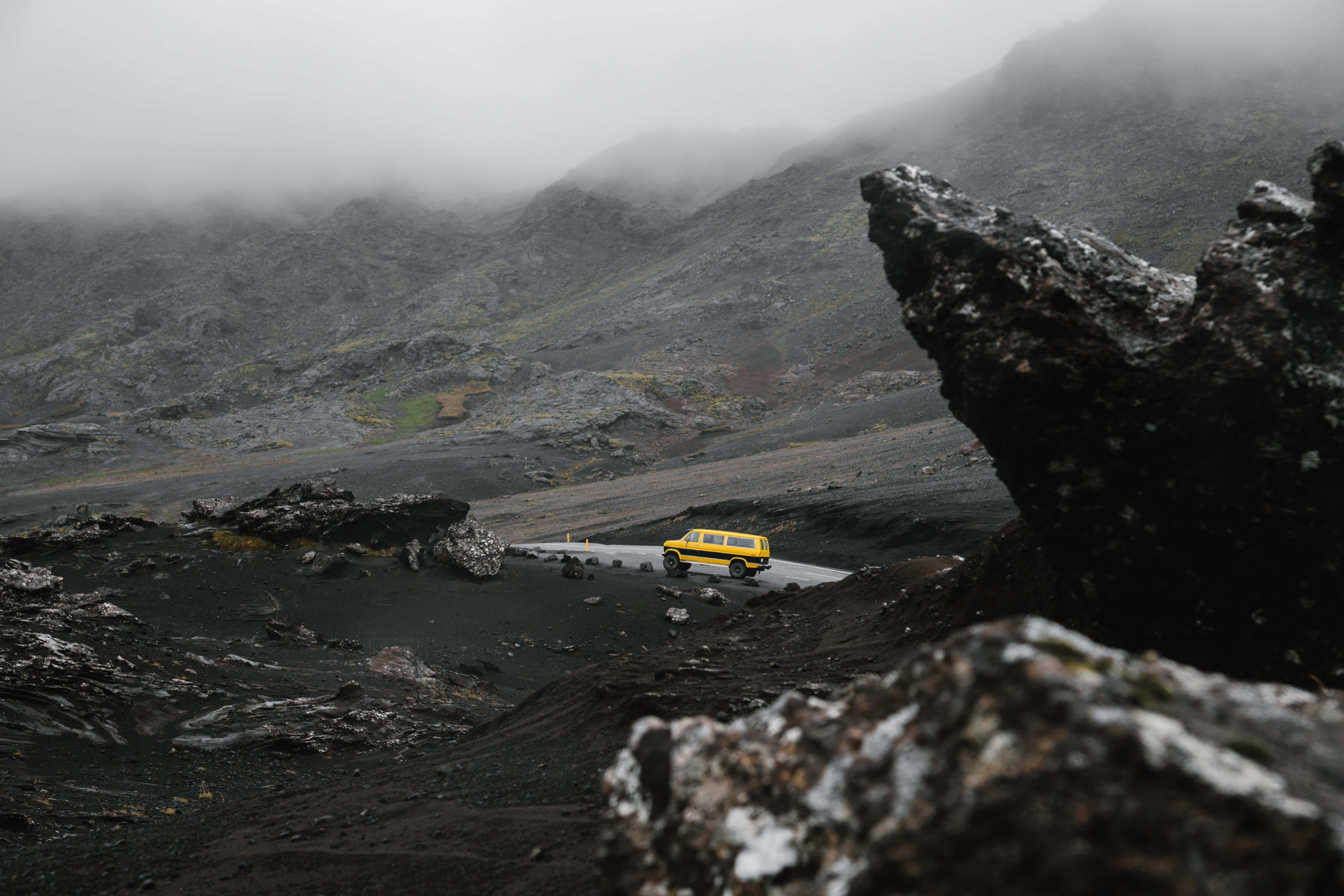 bright yellow van, winding road, misty volcanic landscape, 4K Desktop Wallpaper