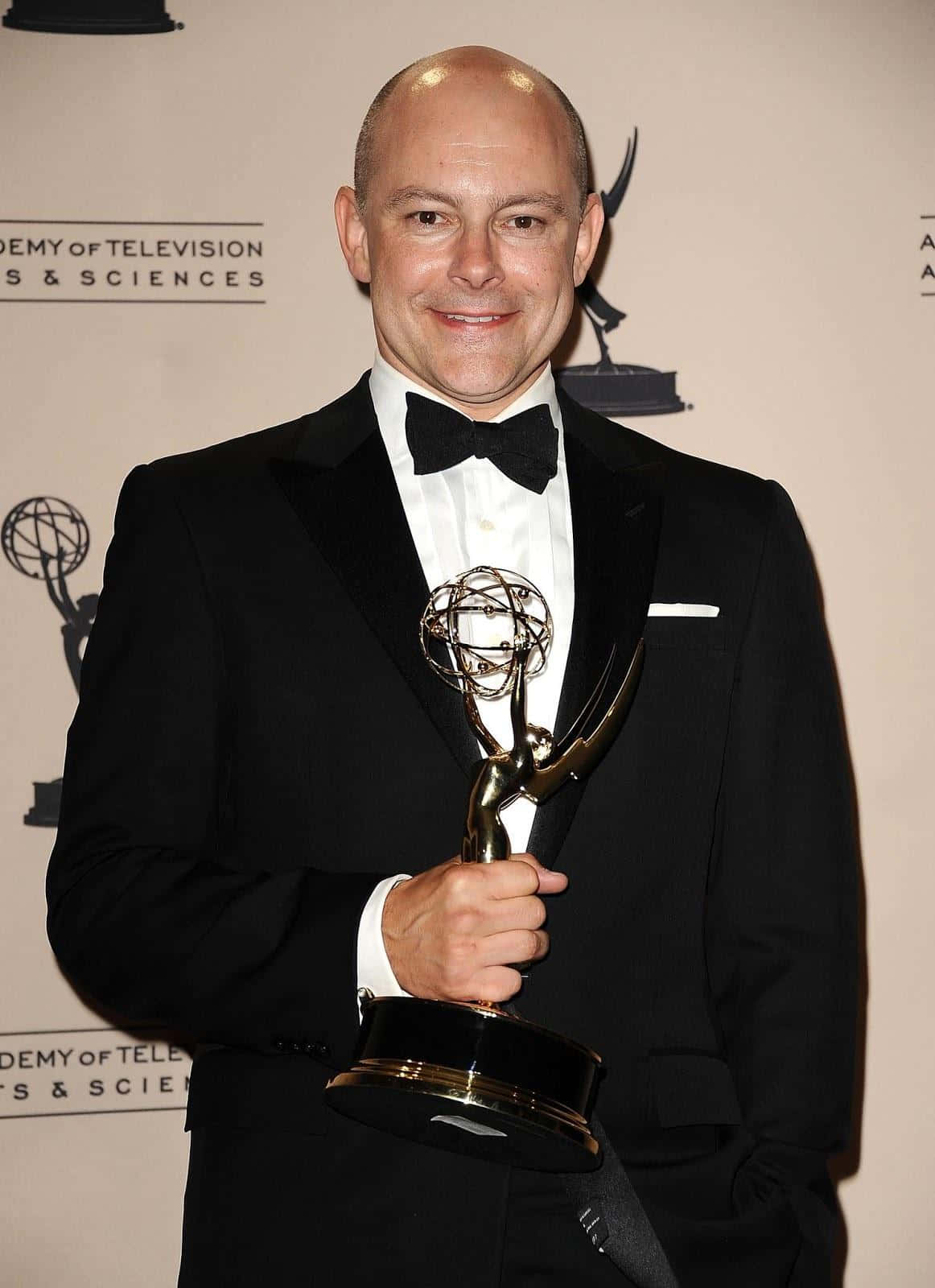 Rob Corddry, black tuxedo, golden Emmy Award statue, HD Phone Wallpaper