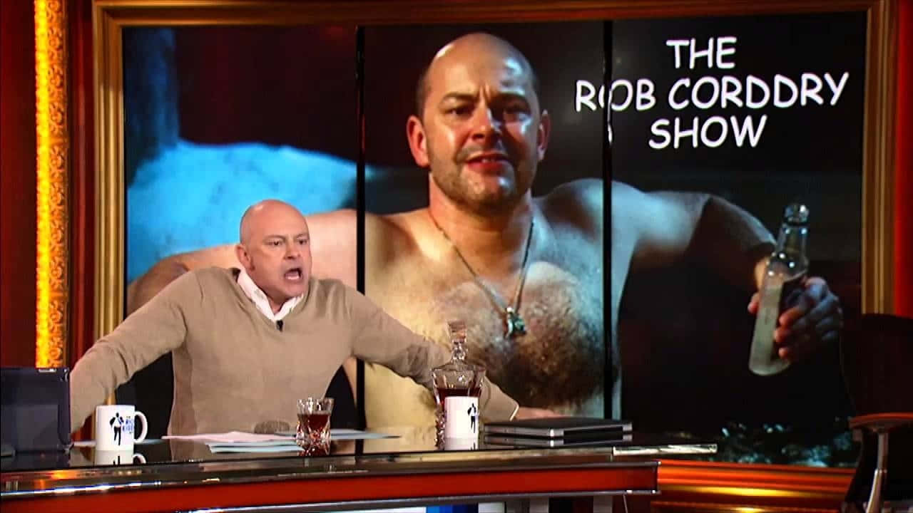 Rob Corddry, beige sweater, talk show desk, HD Desktop Wallpaper