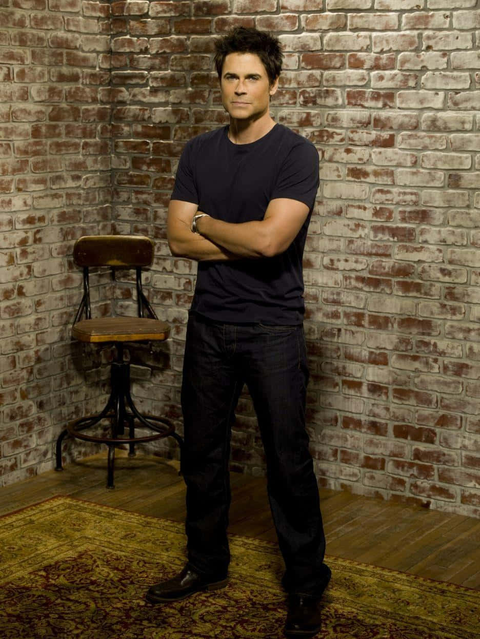 Rob Lowe, dark clothes, weathered brick wall, SD Phone Wallpaper