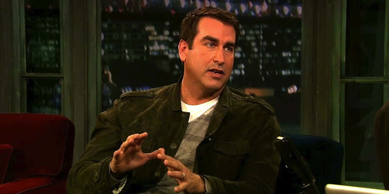 Rob Riggle, dark jacket, red chair, HD Desktop Wallpaper