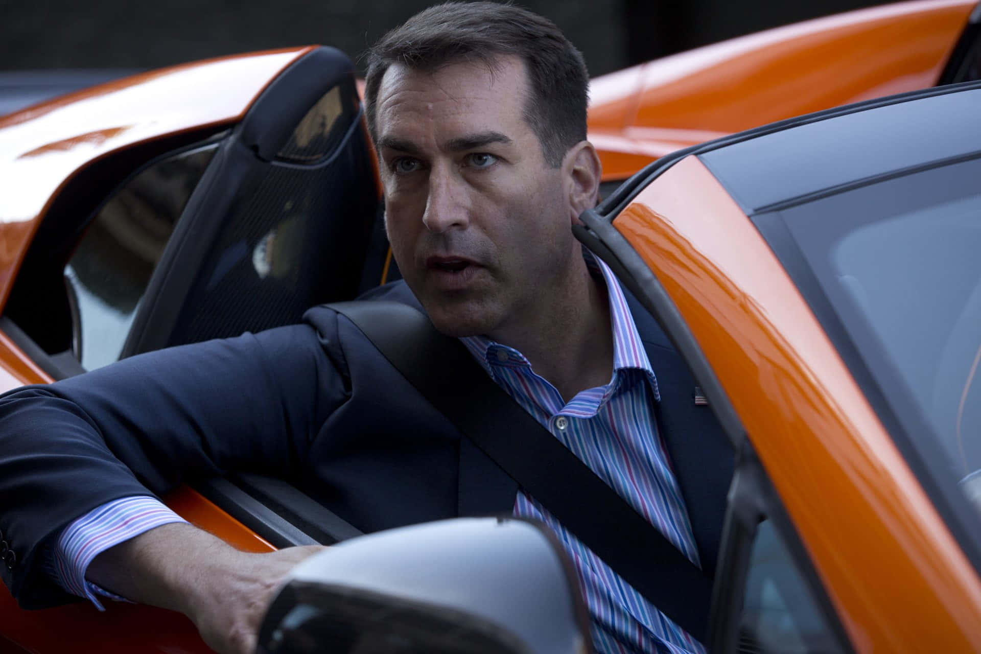 Rob Riggle, bright orange sports car, suit, Full HD Desktop Wallpaper