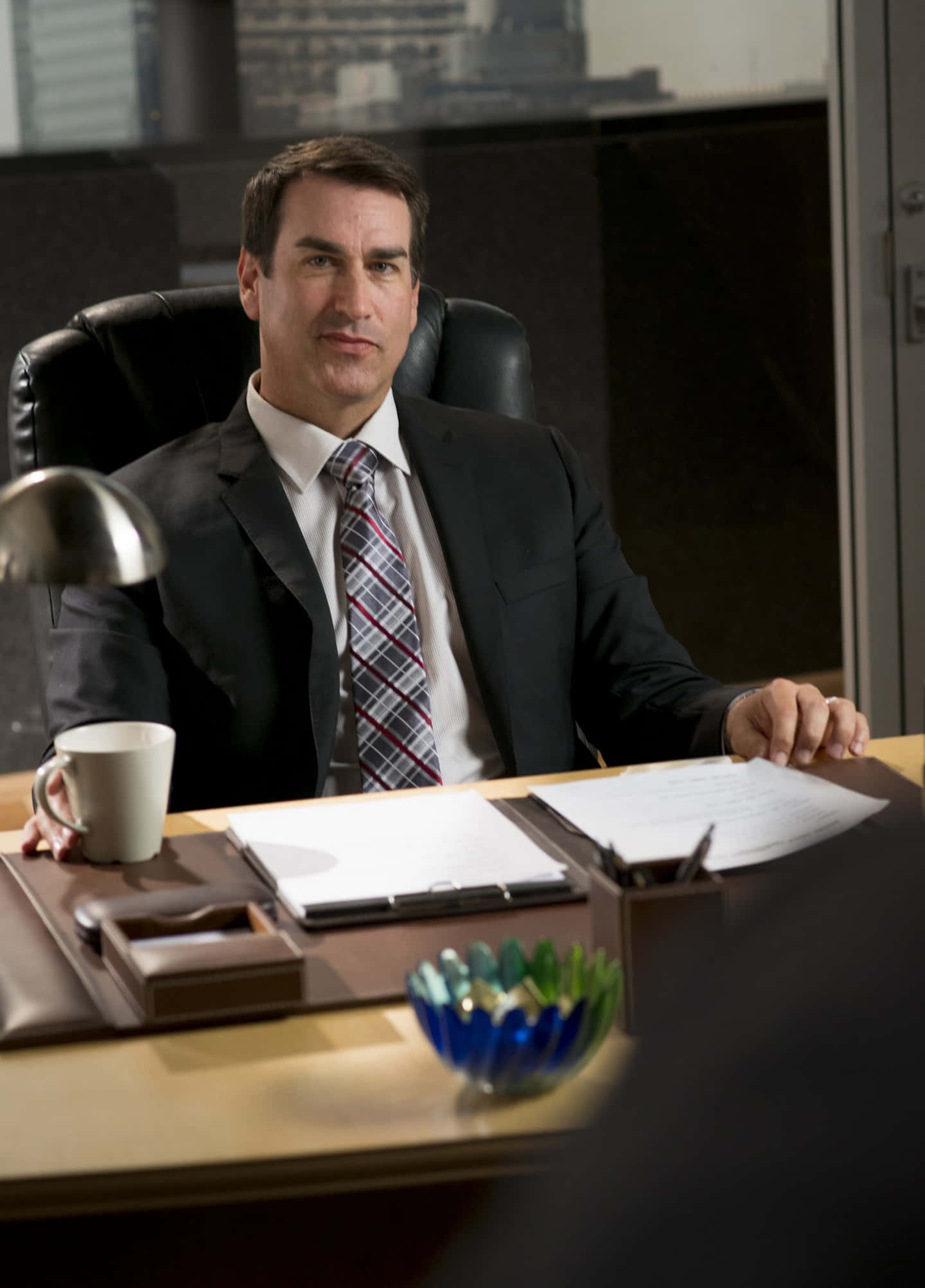 Rob Riggle, dark suit, polished wooden desk, Full HD Phone Wallpaper