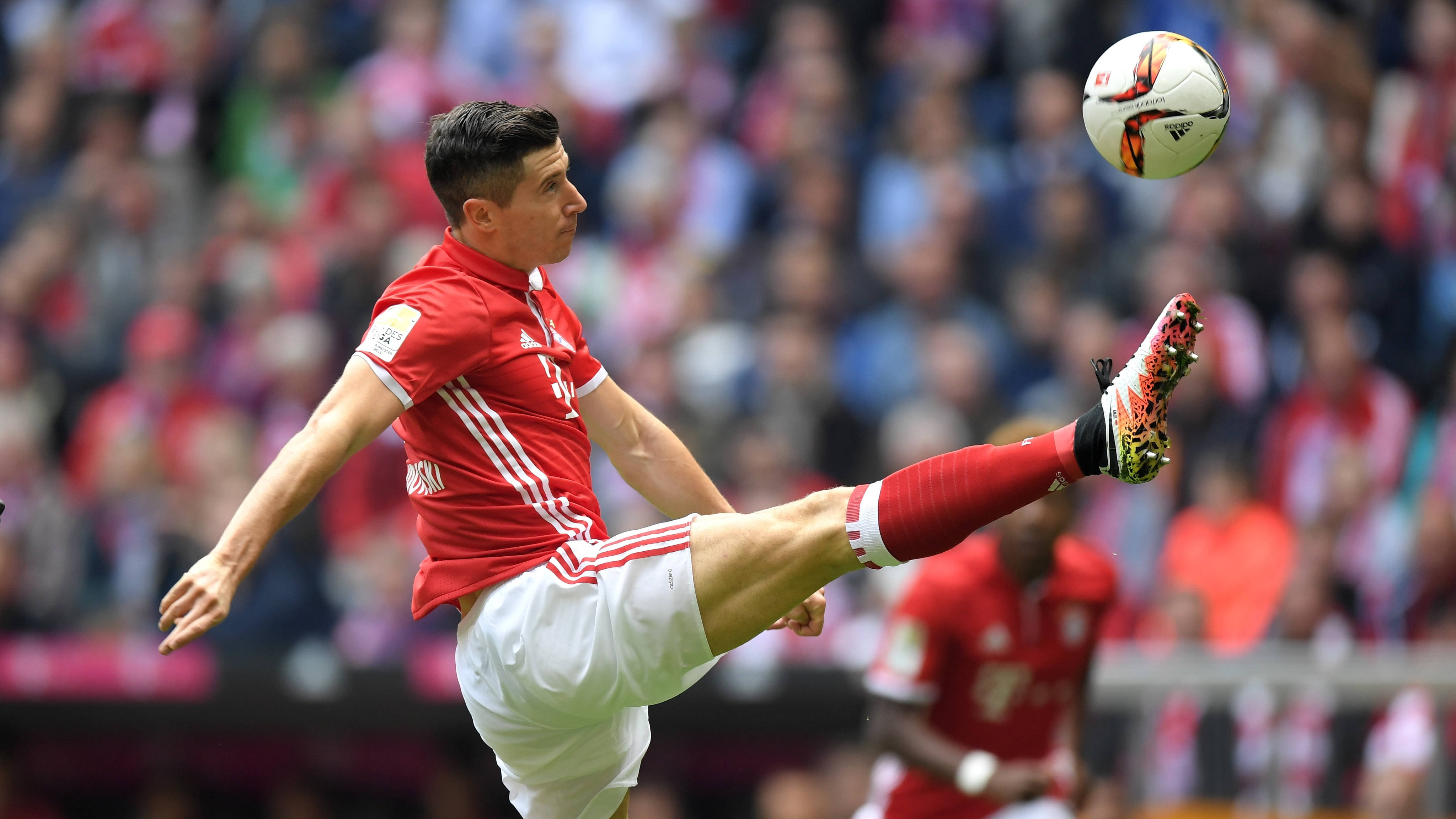 Robert Lewandowski, red jersey, kicks a ball mid-air, 4K Desktop Wallpaper