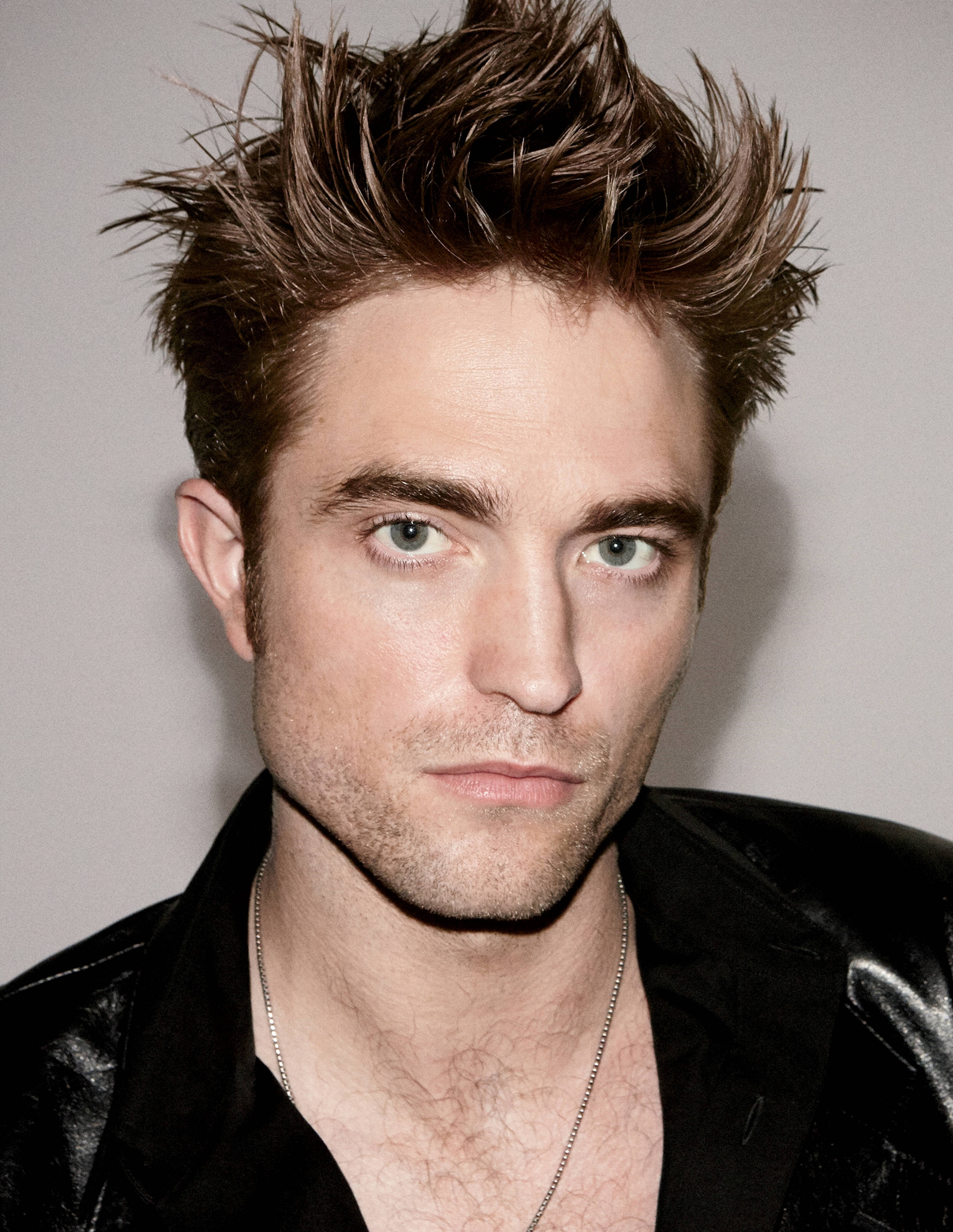 Robert Pattinson, spiky brown hair, intense green eyes, 4K Phone Wallpaper