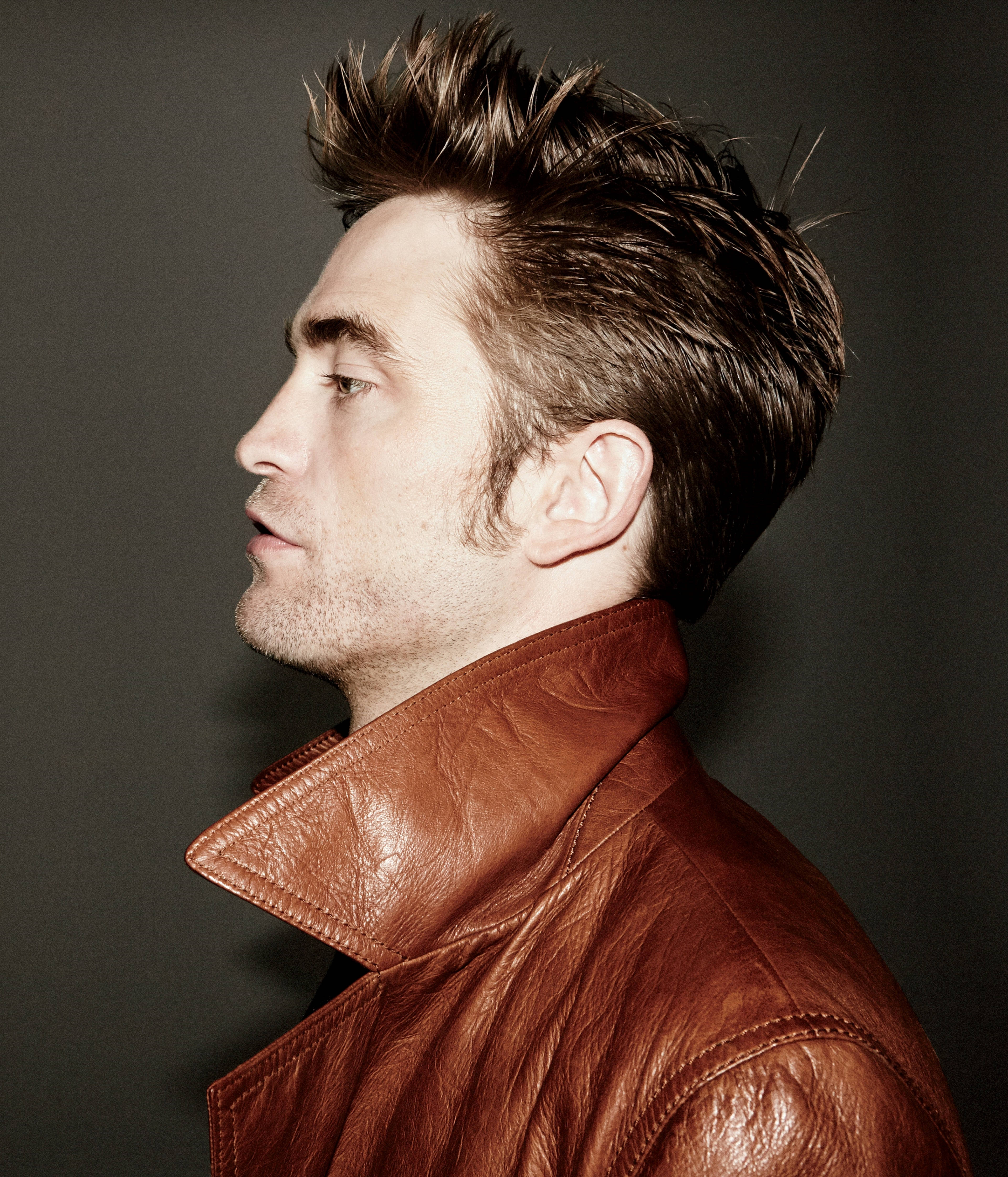 Robert Pattinson, brown leather jacket, muted gray background, 4K Phone Wallpaper