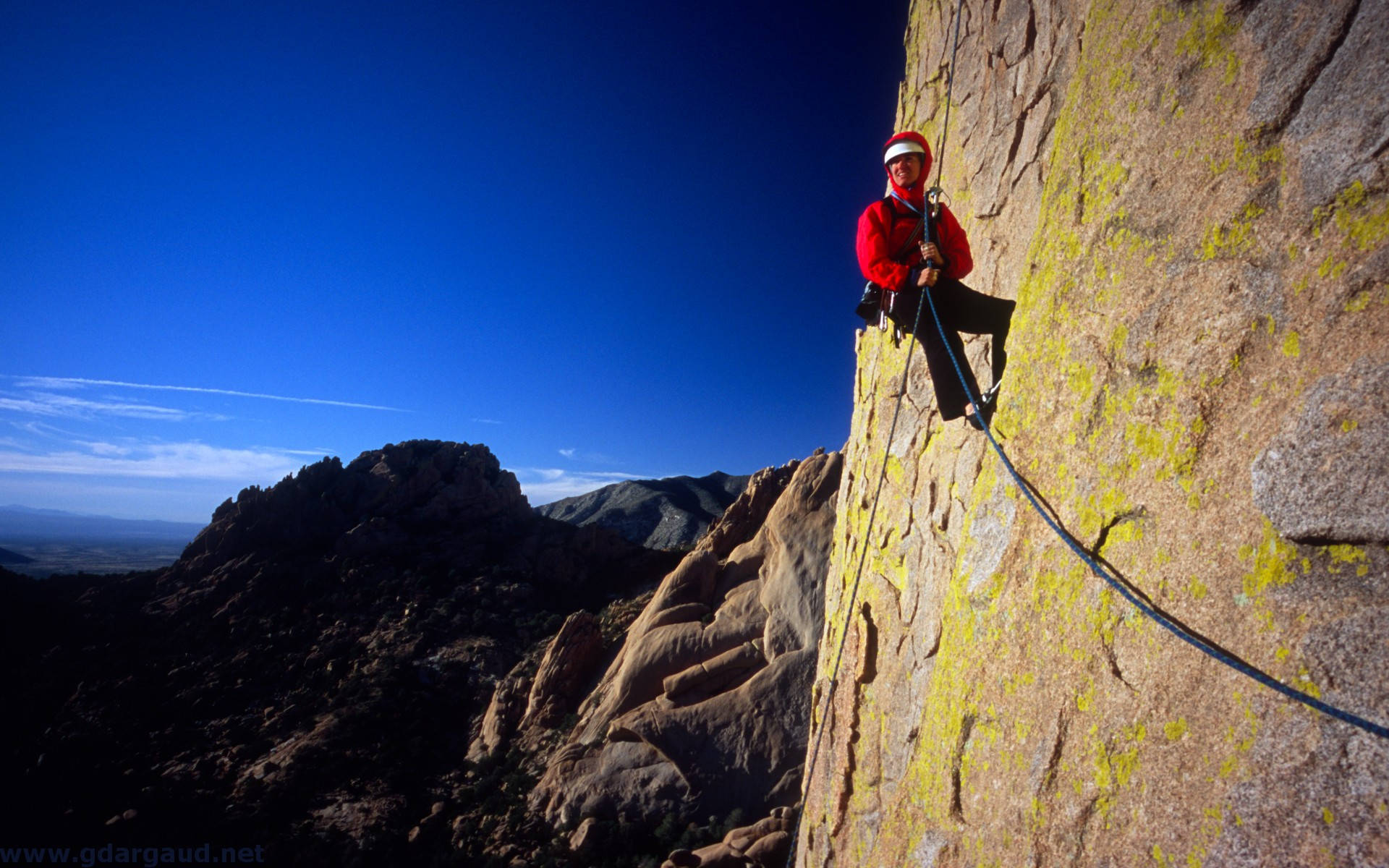 red jacket, yellow lichen, vast blue sky, Full HD Desktop Wallpaper