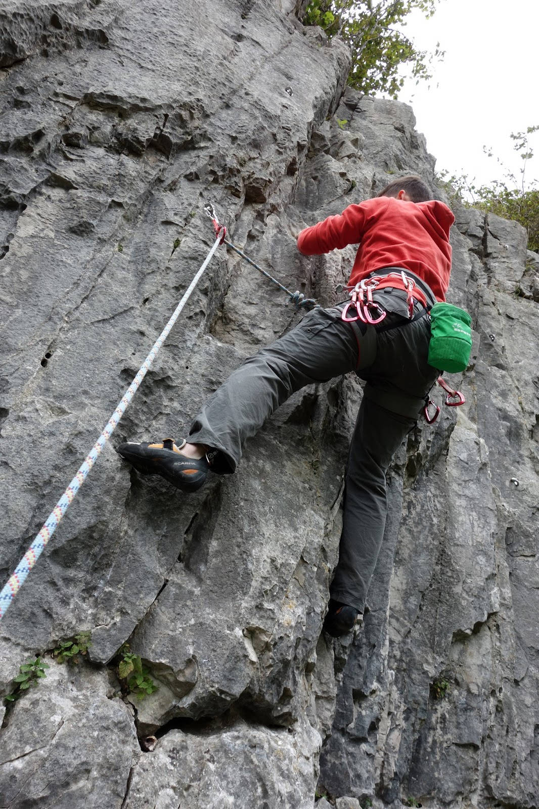 red hoodie, rugged gray rock face, rope, HD Phone Wallpaper