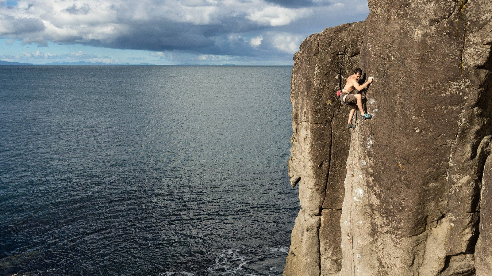 topless man, rock climbing, rugged coastal cliff face, Full HD Desktop Wallpaper
