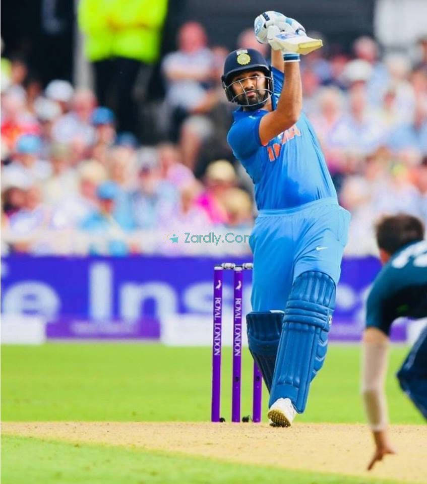 Rohit Sharma, blue uniform, bat raised high, SD Phone Wallpaper