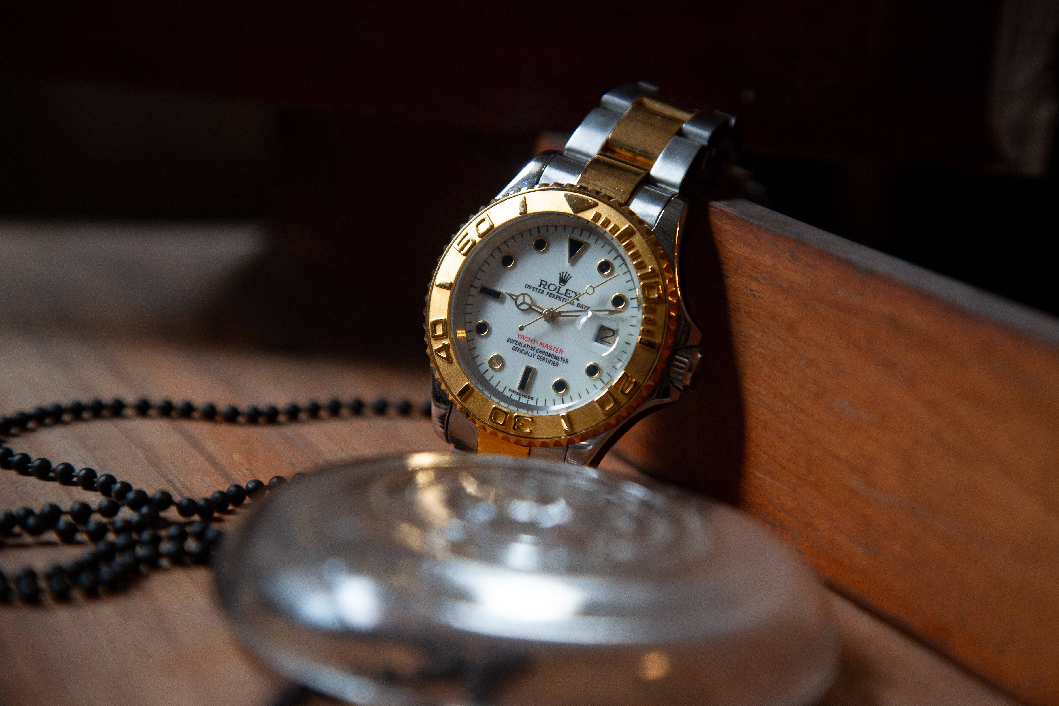 Rolex, gold and steel, wooden surface, 2K Desktop Wallpaper