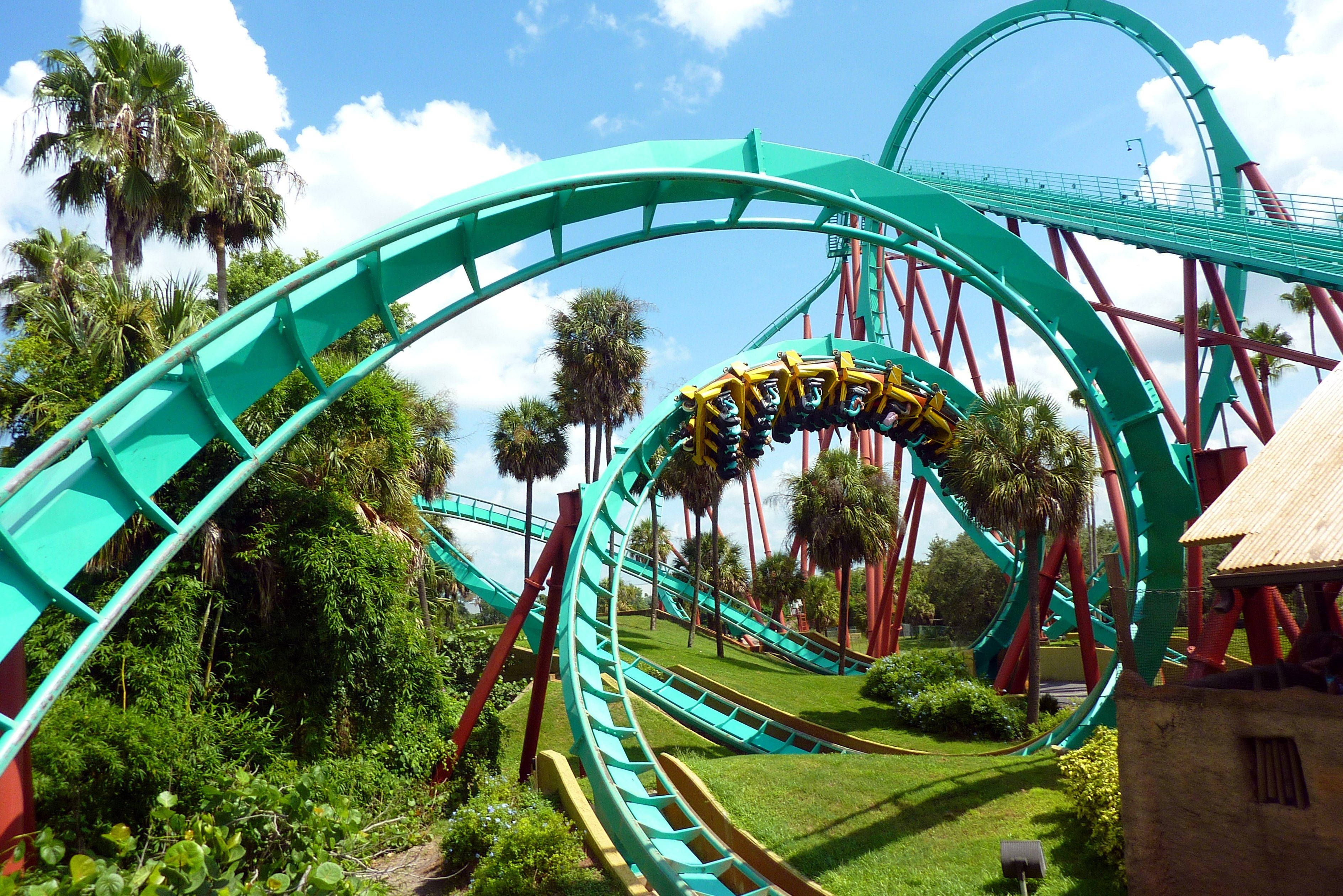 teal painted roller coaster, turquoise roller coaster, lush palm trees, 2K Desktop Wallpaper