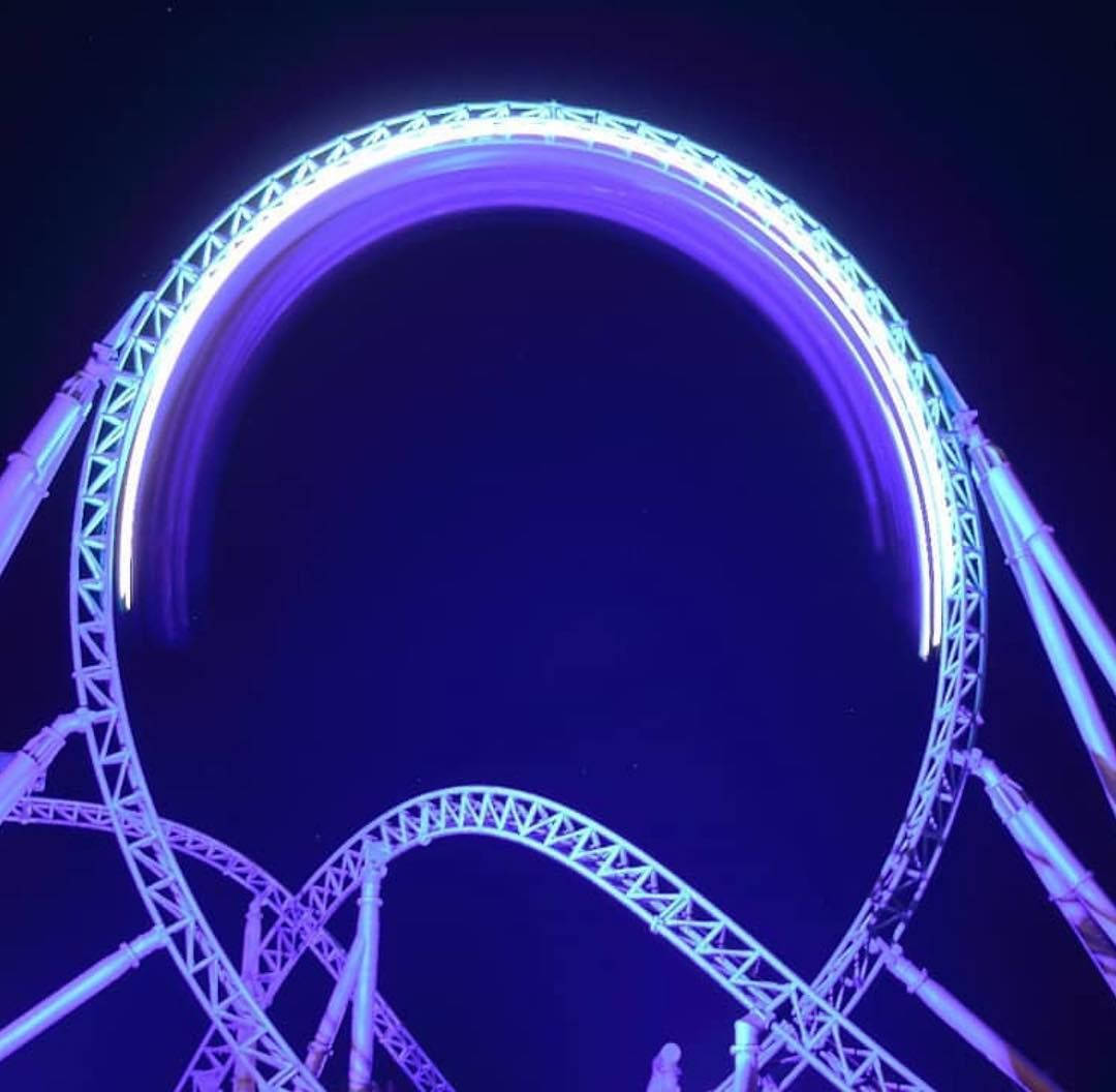 roller coaster, glowing purple light, dark night sky, SD Desktop Wallpaper
