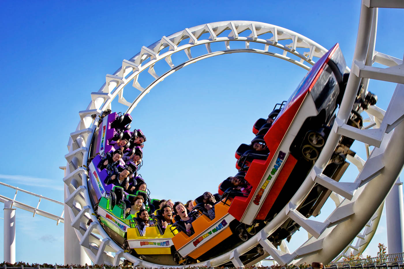 rainbow-colored roller coaster, clear blue sky, upside down loop, HD Desktop Wallpaper