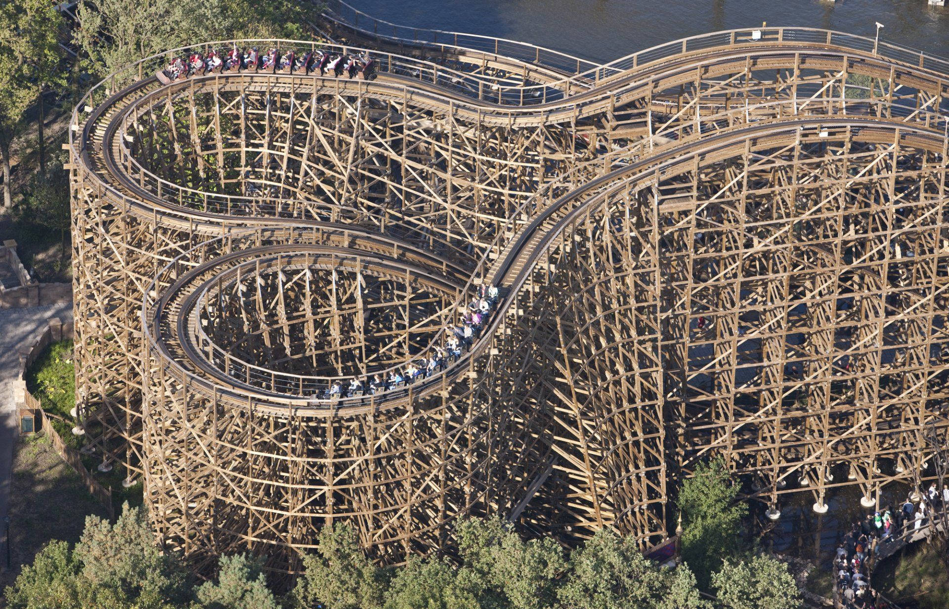 massive wooden roller coaster, aerial view, twisting through trees, Full HD Desktop Wallpaper