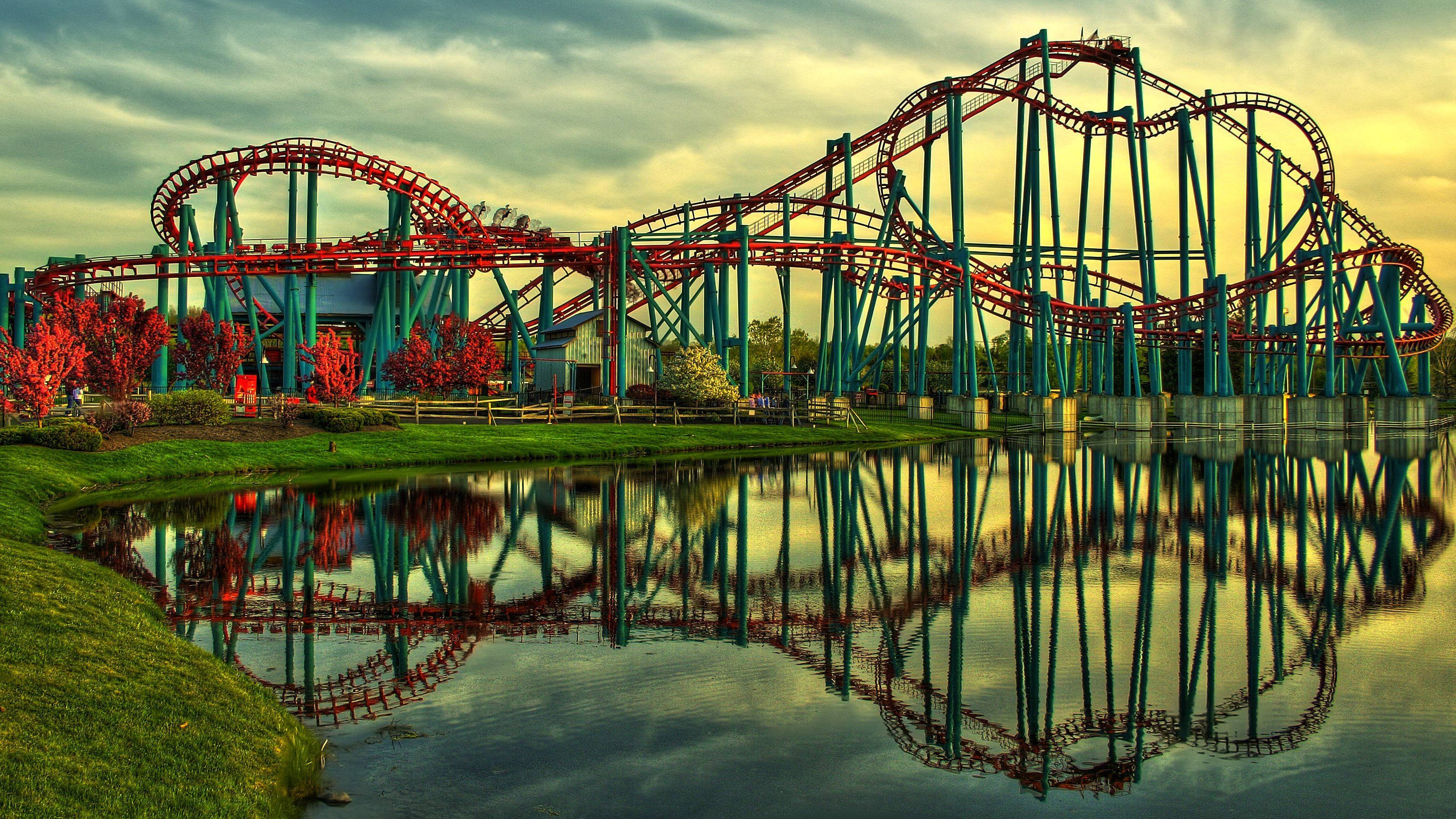 roller coaster, calm pond, golden hour, 2K Desktop Wallpaper