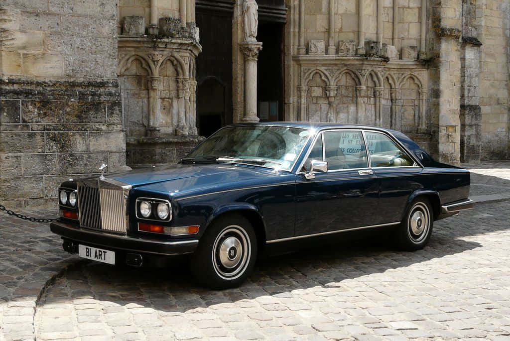 Rolls Royce Camargue, dark blue, sunlit cobblestone street, SD Desktop Wallpaper