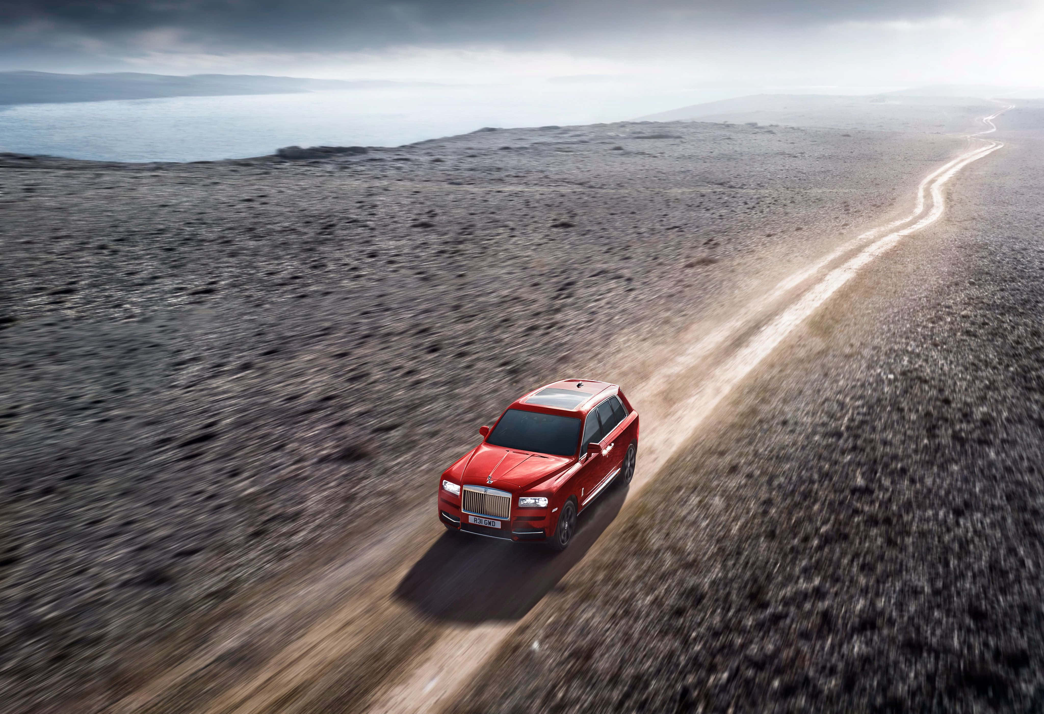 Rolls Royce Cullinan, vibrant red, winding dirt road, 4K Desktop Wallpaper