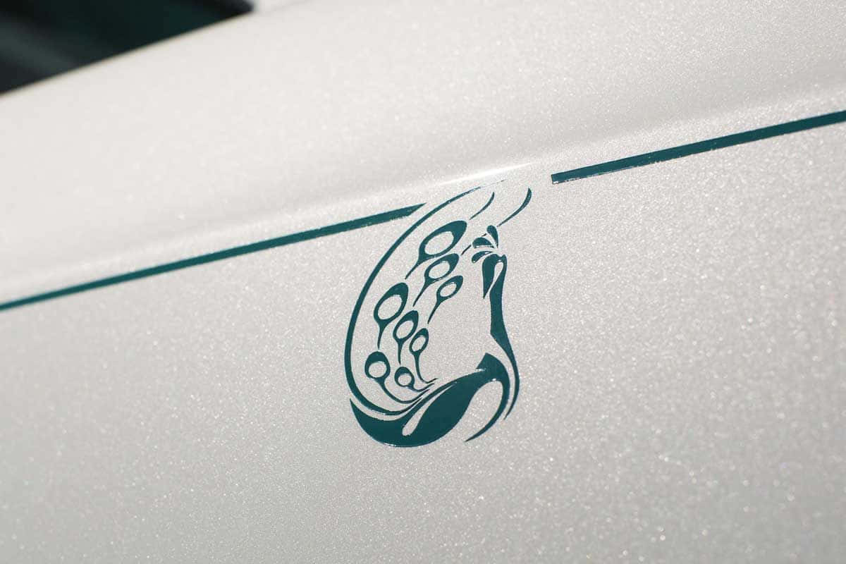 Rolls Royce Phantom Drophead Coupe, teal tribal-style logo, circular motifs, SD Desktop Wallpaper