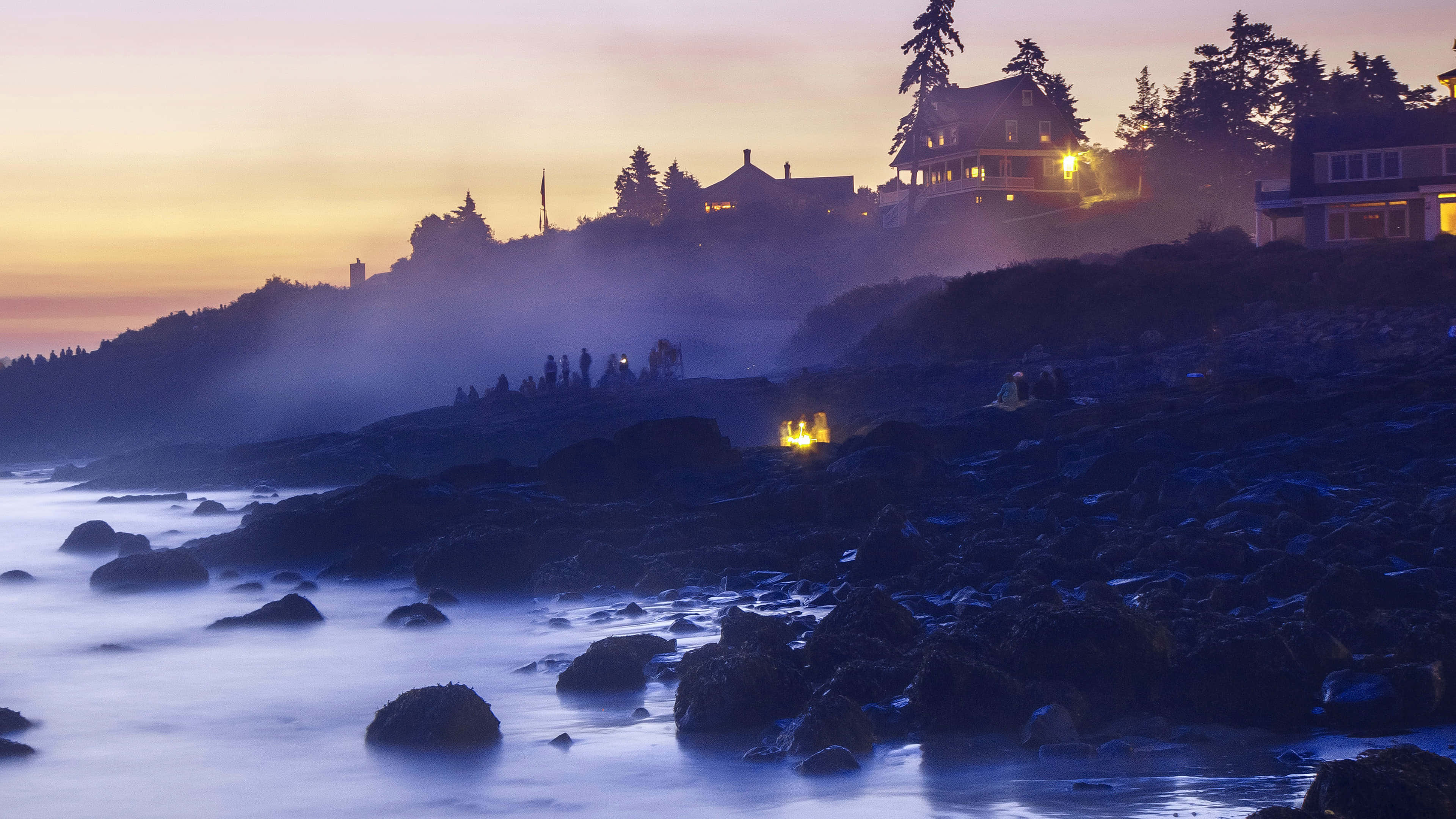 twilight beachside romance, misty twilight coastal scene, glowing house lights, 4K Desktop Wallpaper