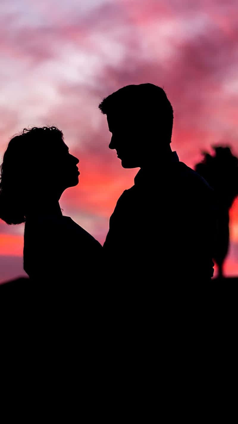 silhouette, couple, vibrant pink and orange sunset sky, HD Phone Wallpaper