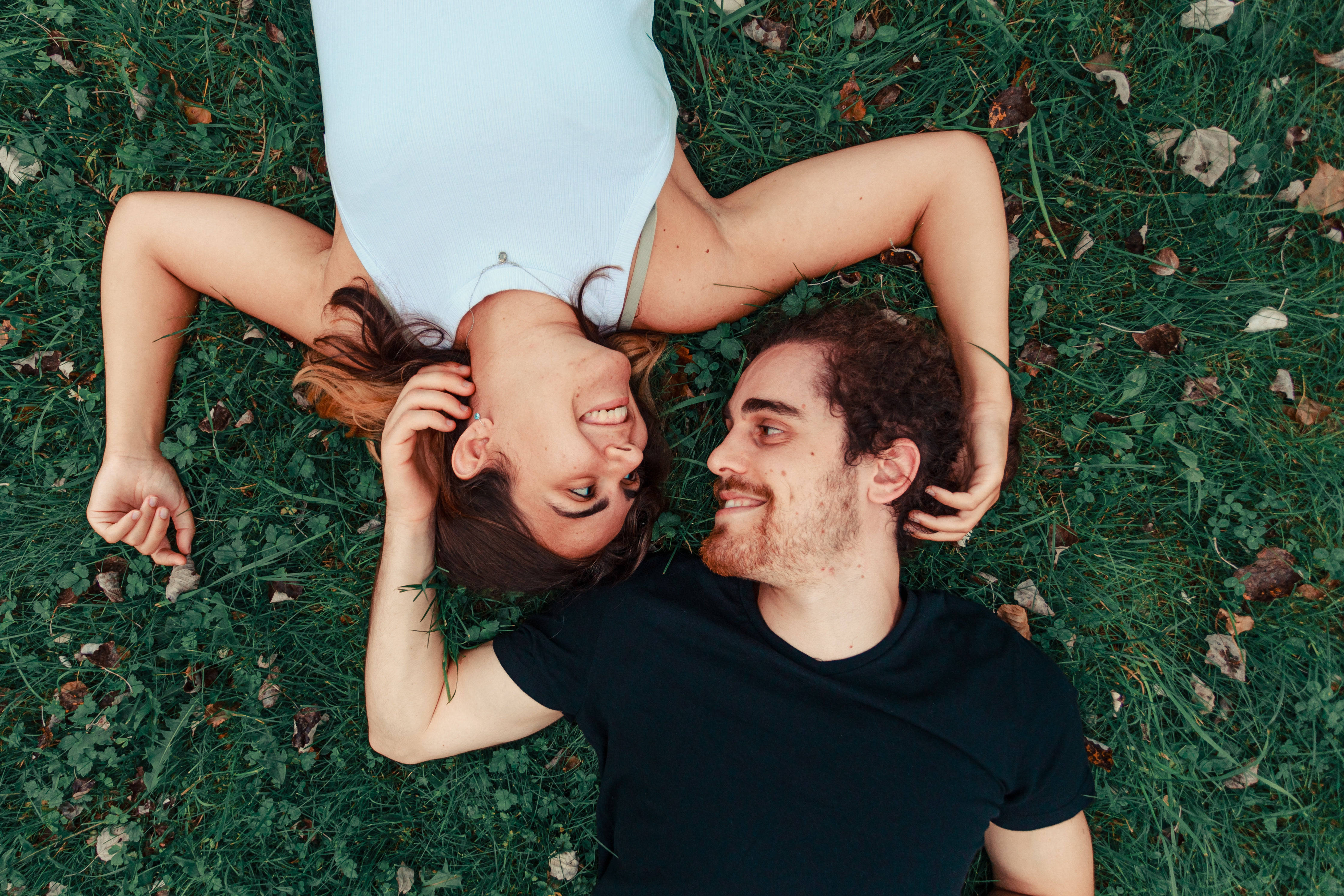 Romantic Couple, grass, lying on the ground, 4K Desktop Wallpaper