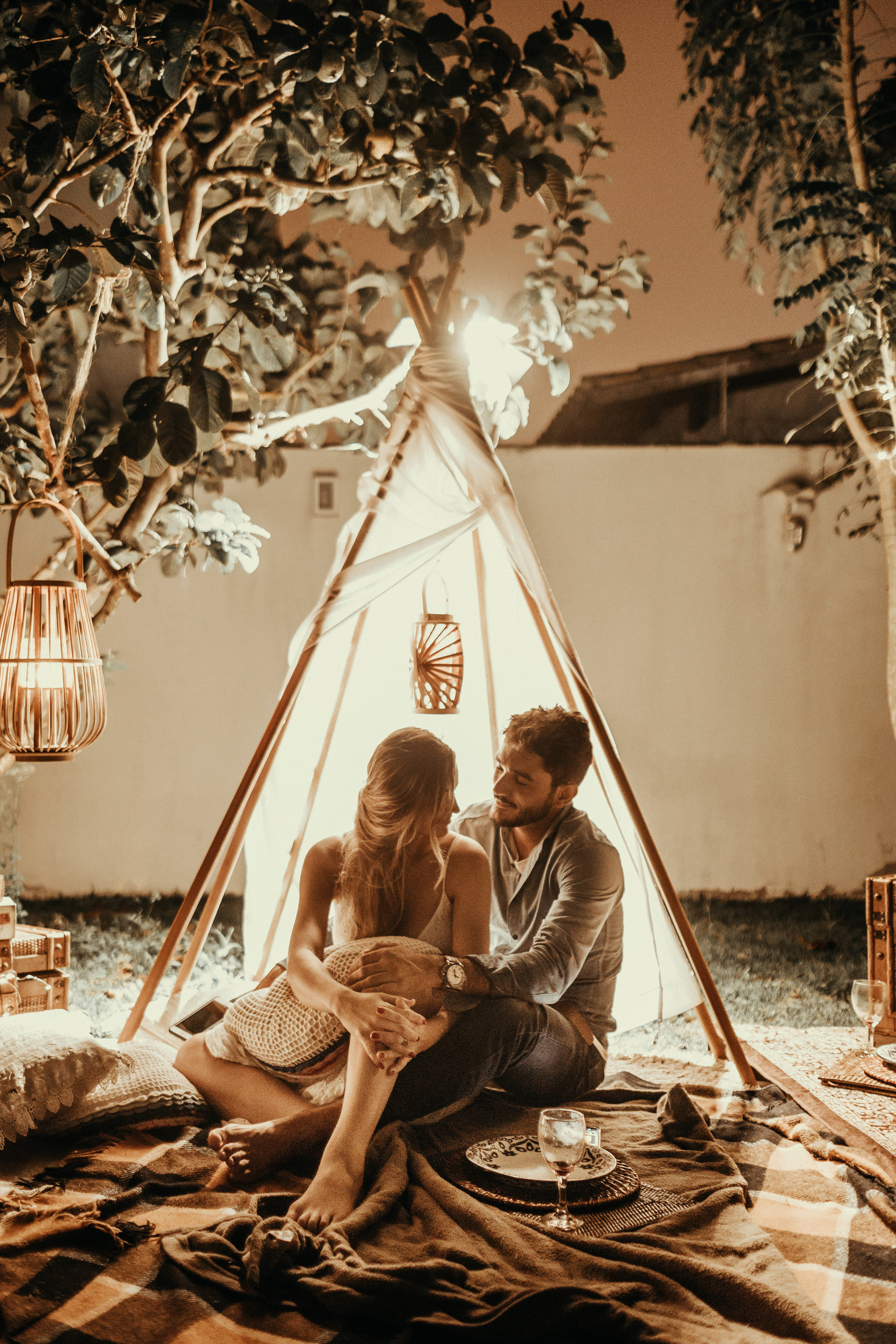 glowing teepee, tree branches, warm lanterns, 5K Phone Wallpaper