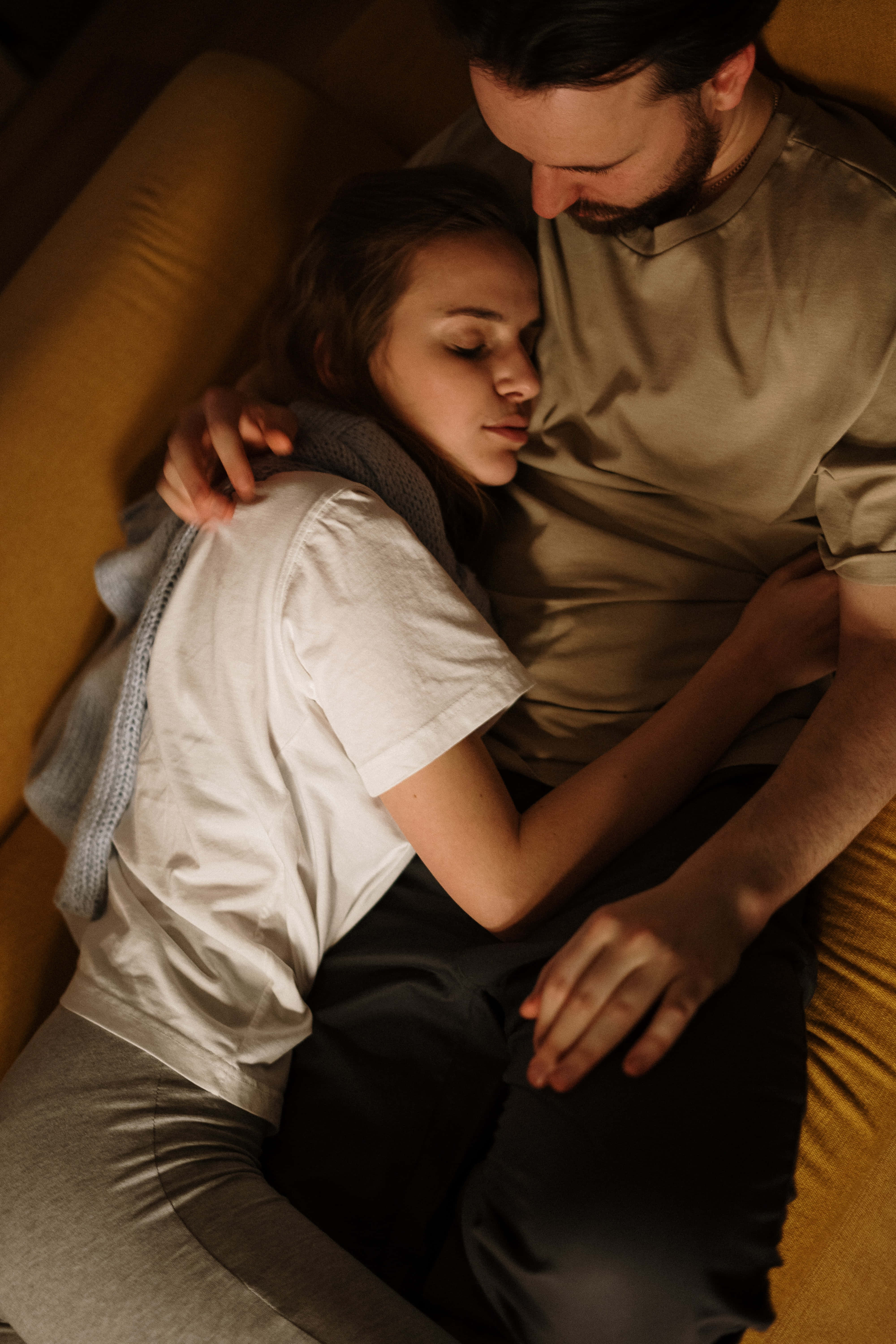 mustard yellow couch, warm golden light, couple, 5K Phone Wallpaper