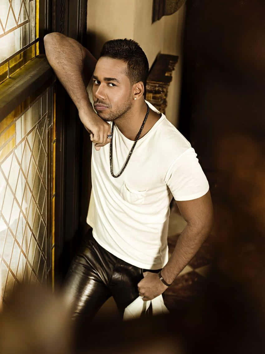 Romeo Santos, white tee, black leather pants, SD Phone Wallpaper