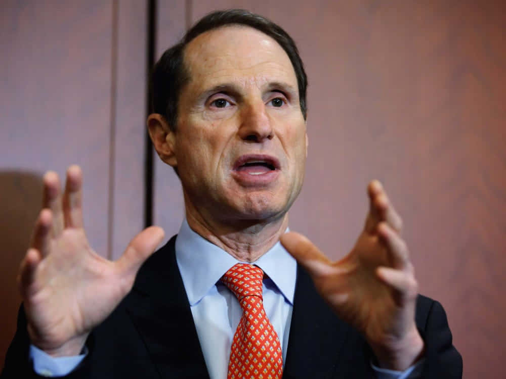 Ron Wyden, dark suit, orange patterned tie, SD Desktop Wallpaper