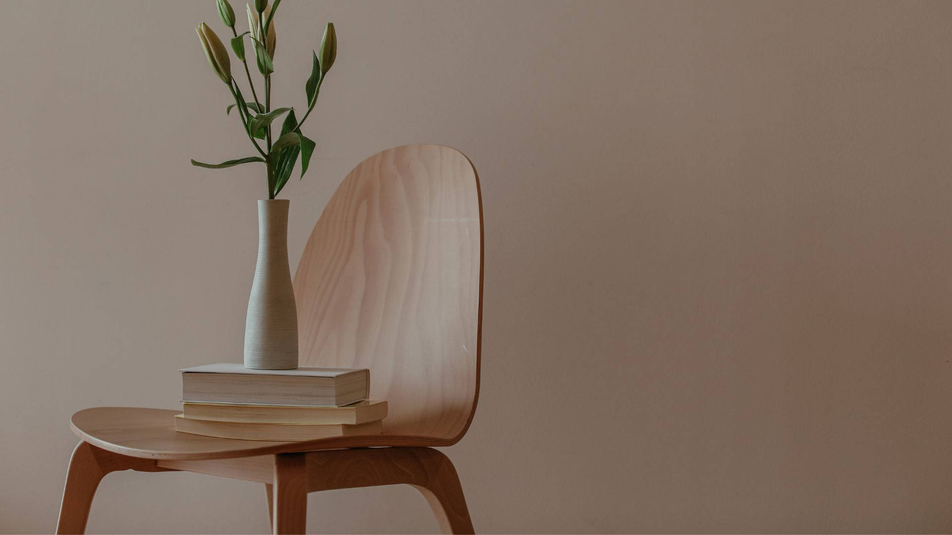 minimalist wooden chair, stacked books, vase with green buds, Full HD Desktop Wallpaper