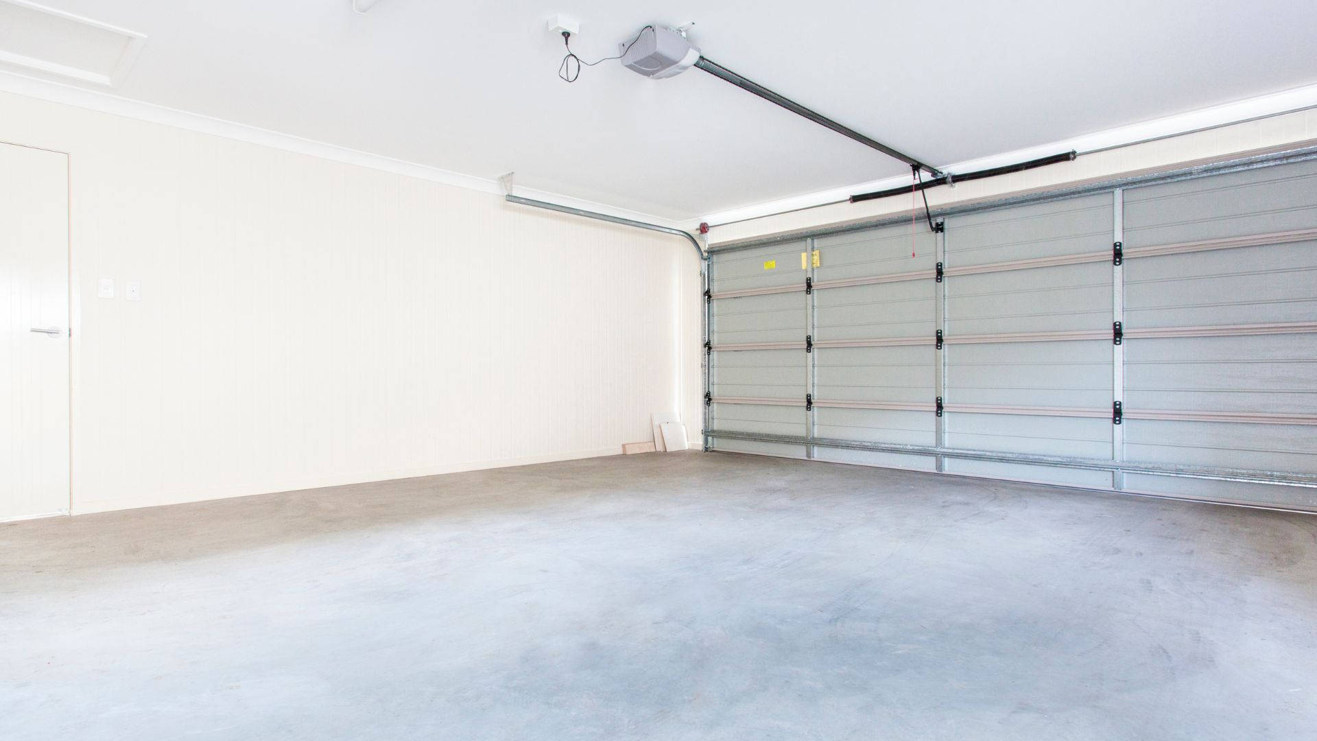 modern minimalist garage storage room, concrete floor, sectional door, Full HD Desktop Wallpaper