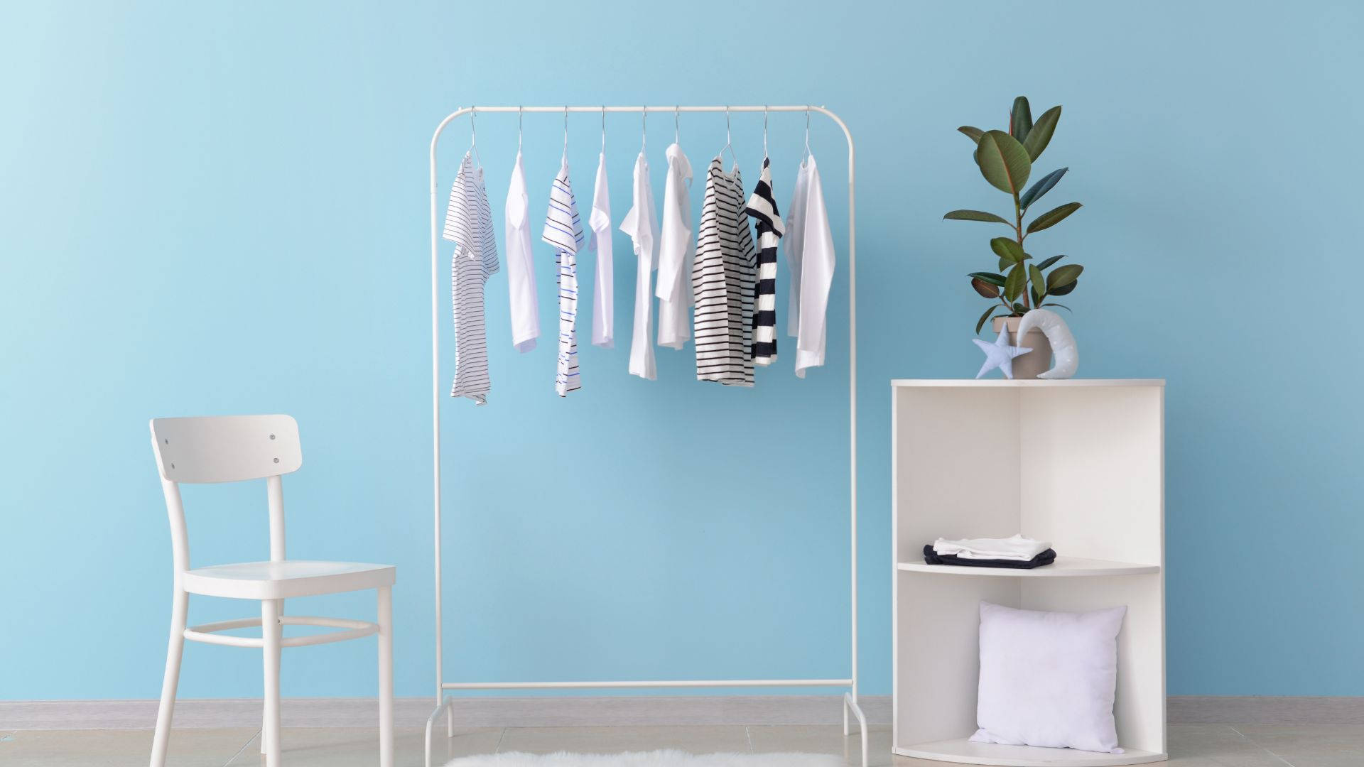 simplistic clothes rack furniture, white clothing rack, soft blue wall, Full HD Desktop Wallpaper