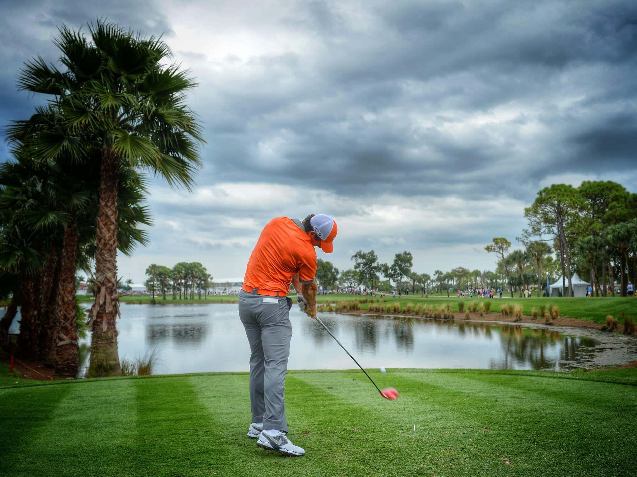 Rory Mcilroy, orange shirt, lush green course, Full HD Desktop Wallpaper