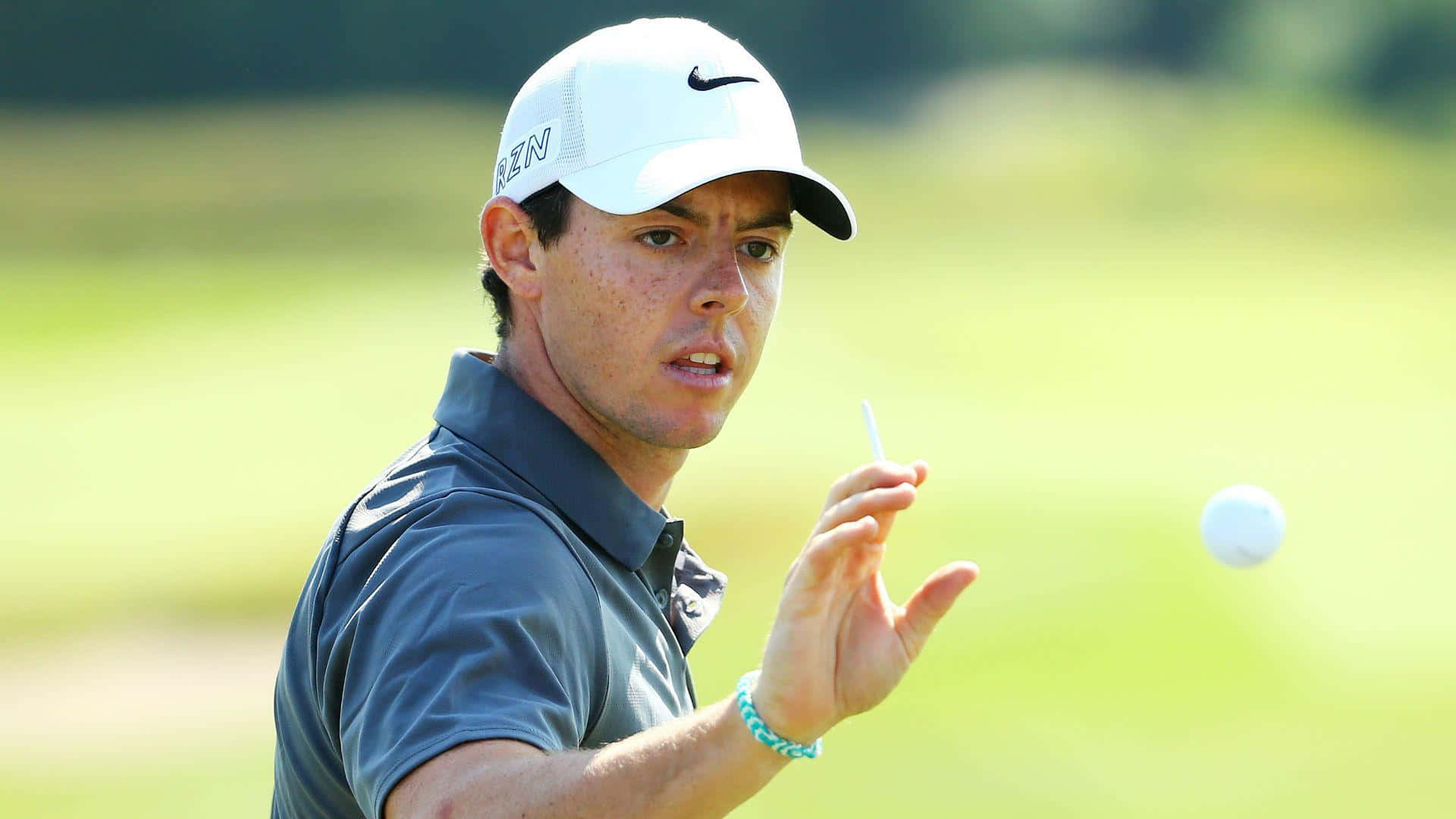 Rory McIlroy, mid-swing, sunlit golf course, Full HD Desktop Wallpaper