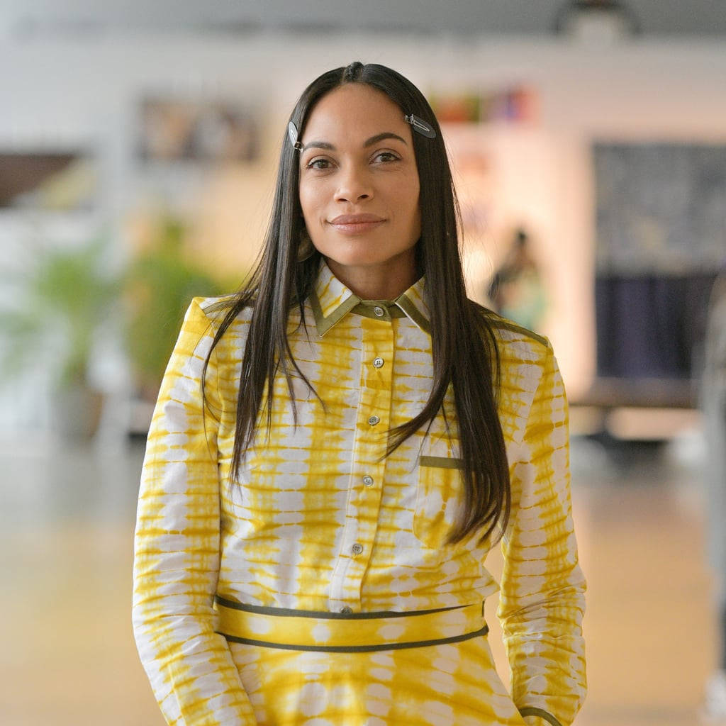 Rosario Dawson, vibrant yellow tie-dye blouse, bright indoor setting, SD Desktop Wallpaper