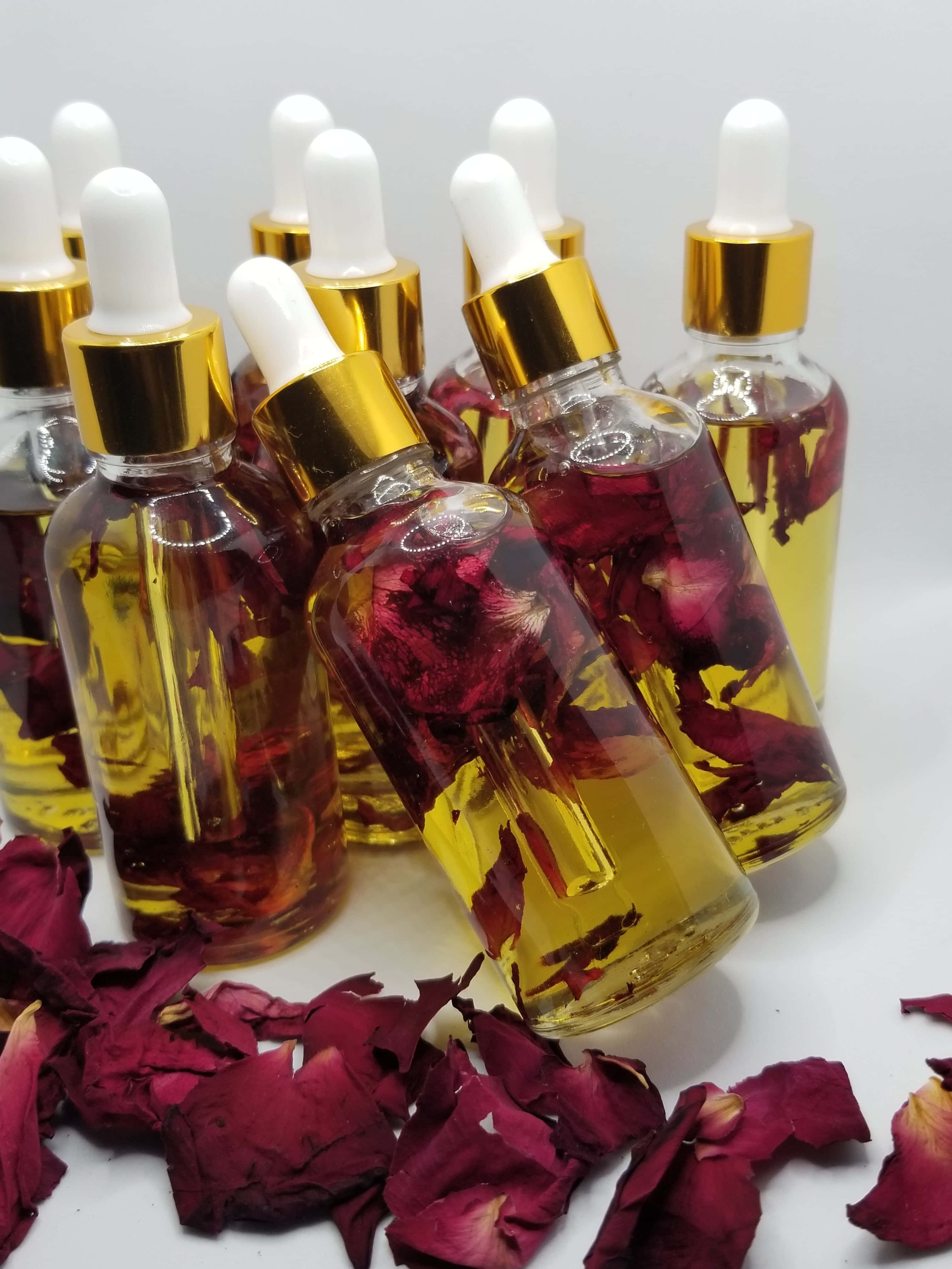 Rose Oil, golden liquid, gold caps, 4K Phone Wallpaper