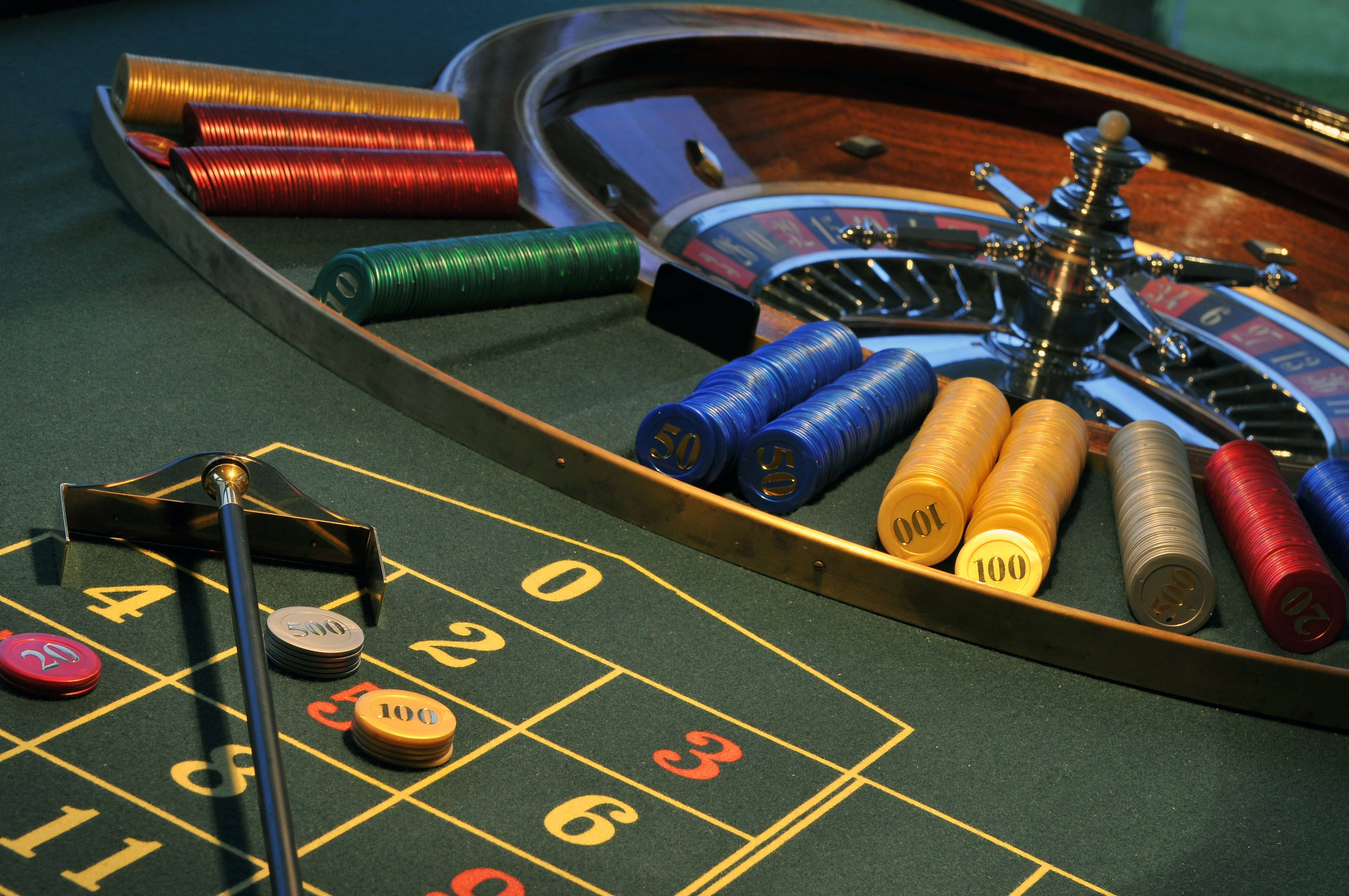 roulette wheel, casino roulette table, colorful stacks of chips, 4K Desktop Wallpaper