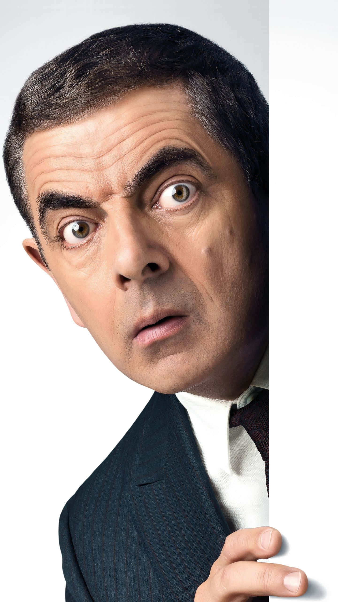 Rowan Atkinson, white panel, dark pinstripe suit, 2K Phone Wallpaper
