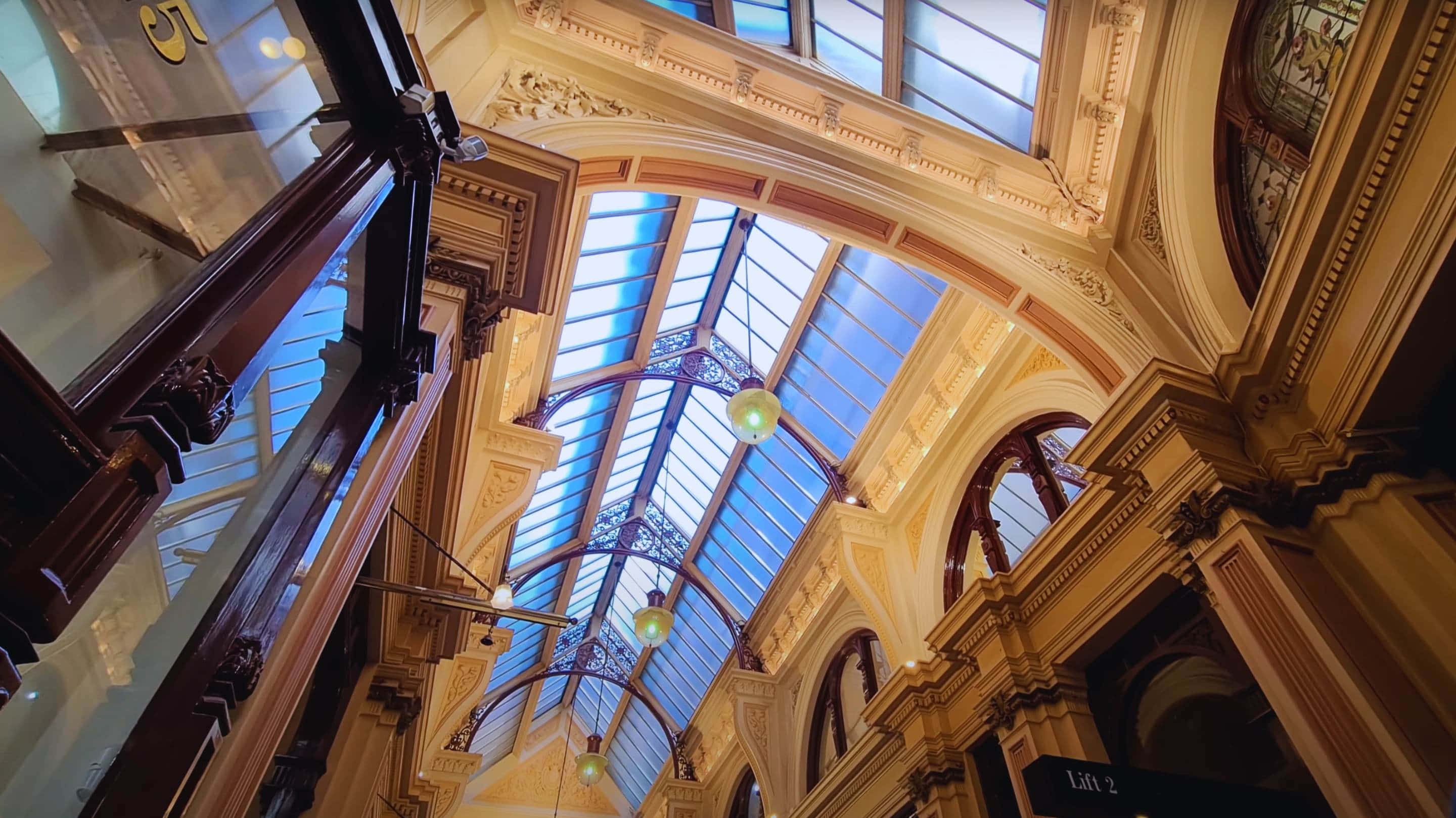 Royal Arcade Melbourne, arched glass ceiling, intricate golden detailing, 2K Desktop Wallpaper