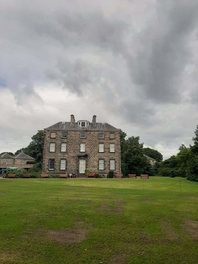 Edinburgh Botanic Garden, stone manor house, heavy overcast sky, SD Phone Wallpaper