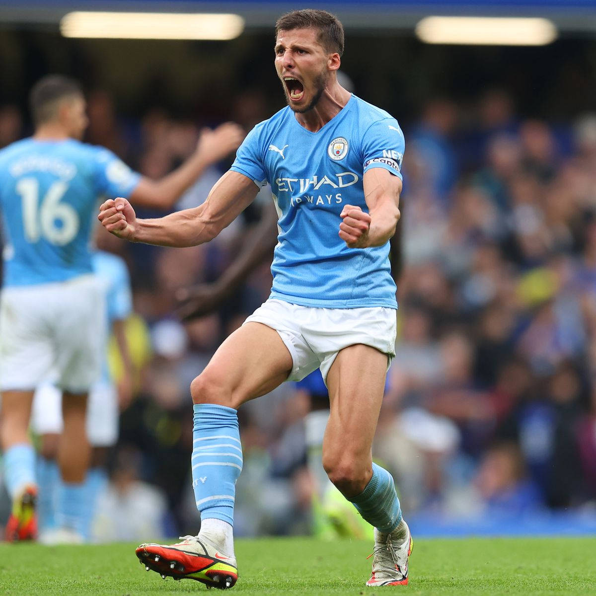 Ruben Dias, light blue jersey, vibrant green pitch, SD Desktop Wallpaper