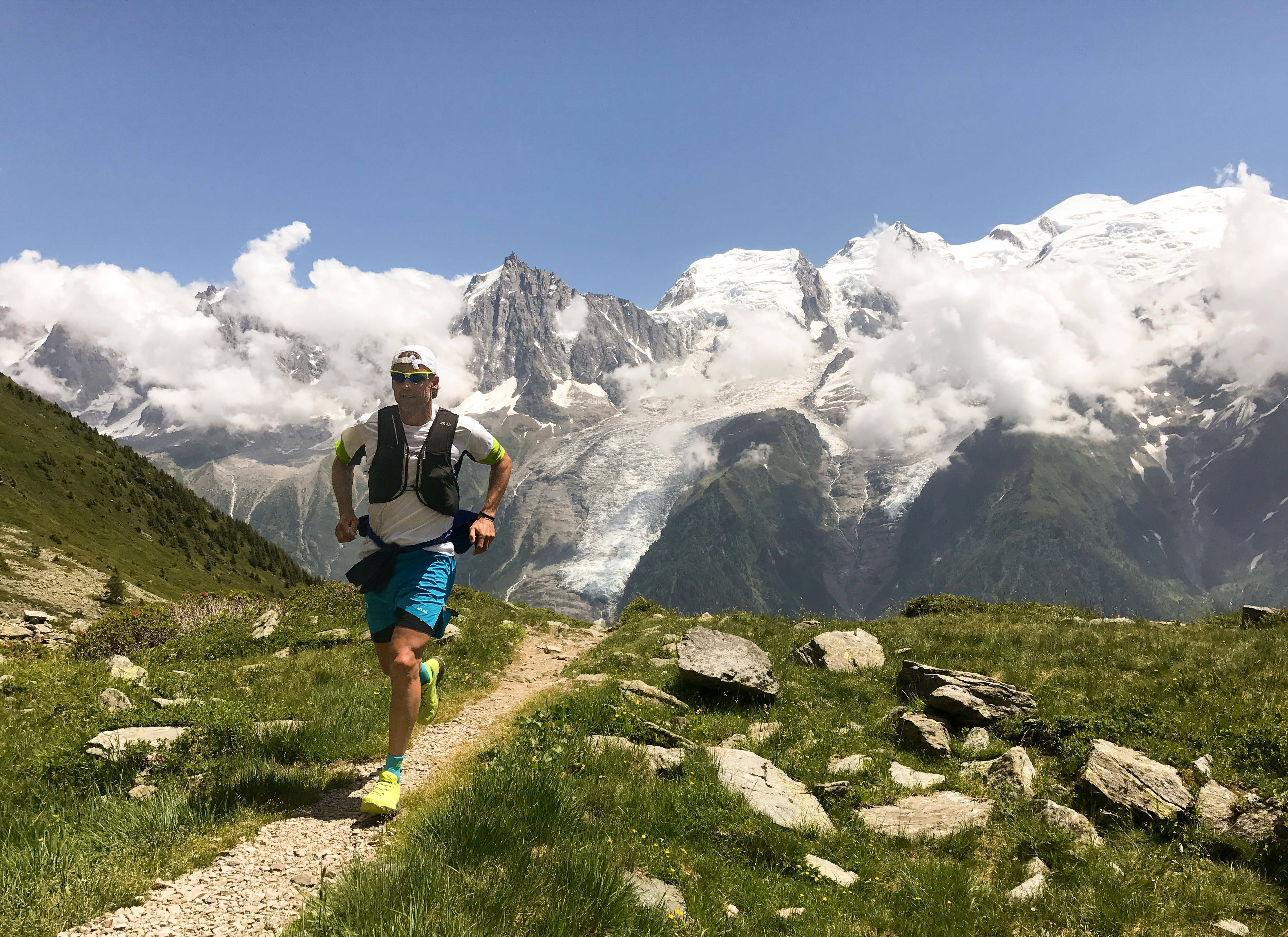 trail runner, rocky path, snow-capped mountains, 4K Desktop Wallpaper