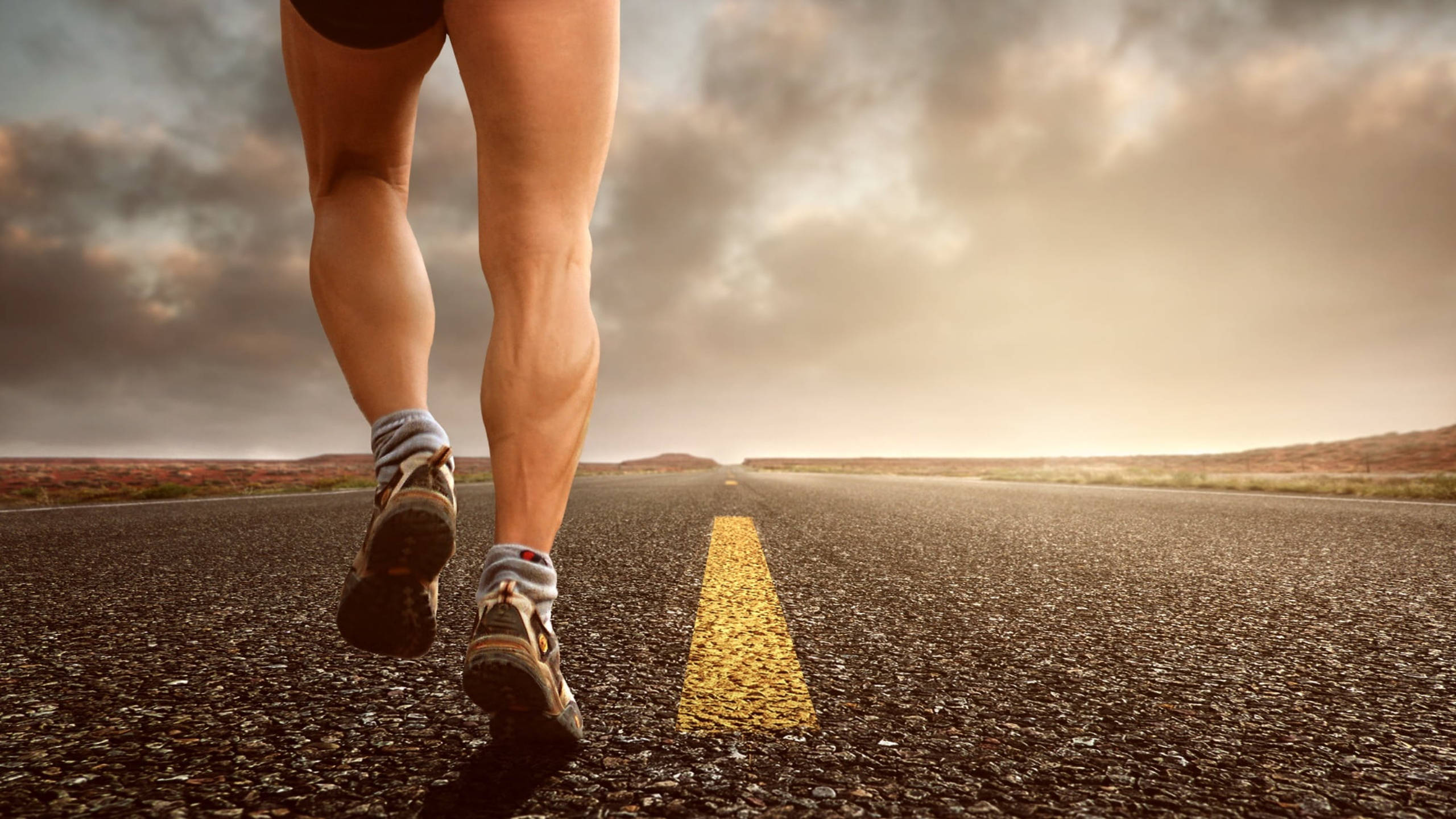 running man, asphalt road, cloudy sky, 2K Desktop Wallpaper