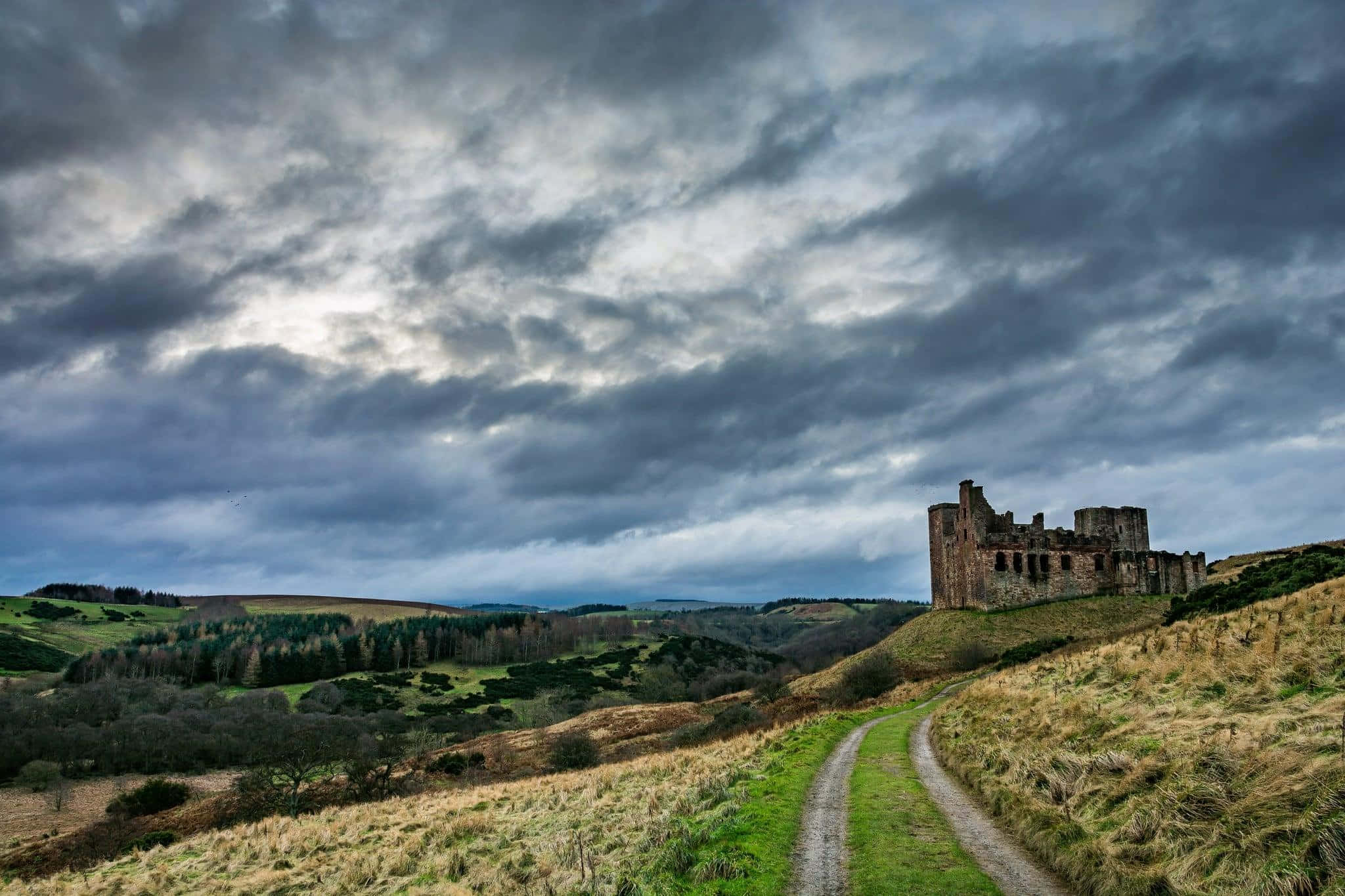 winding dirt path, weathered stone castle ruin, grassy hill, Full HD Desktop Wallpaper