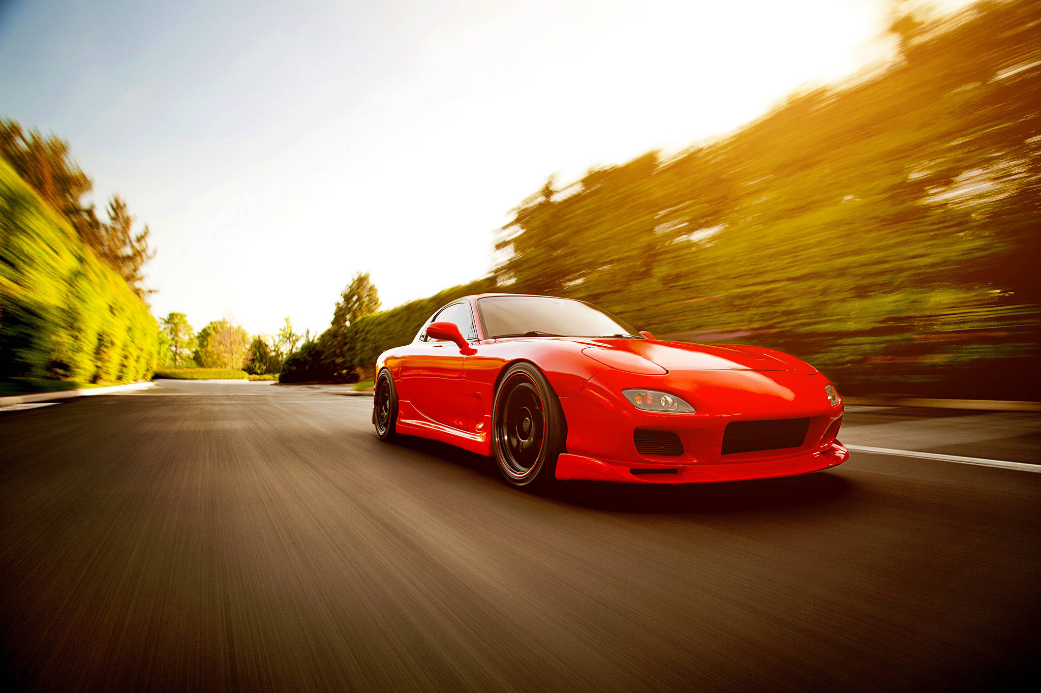 Red RX7, winding road, blurred green trees, Full HD Desktop Wallpaper