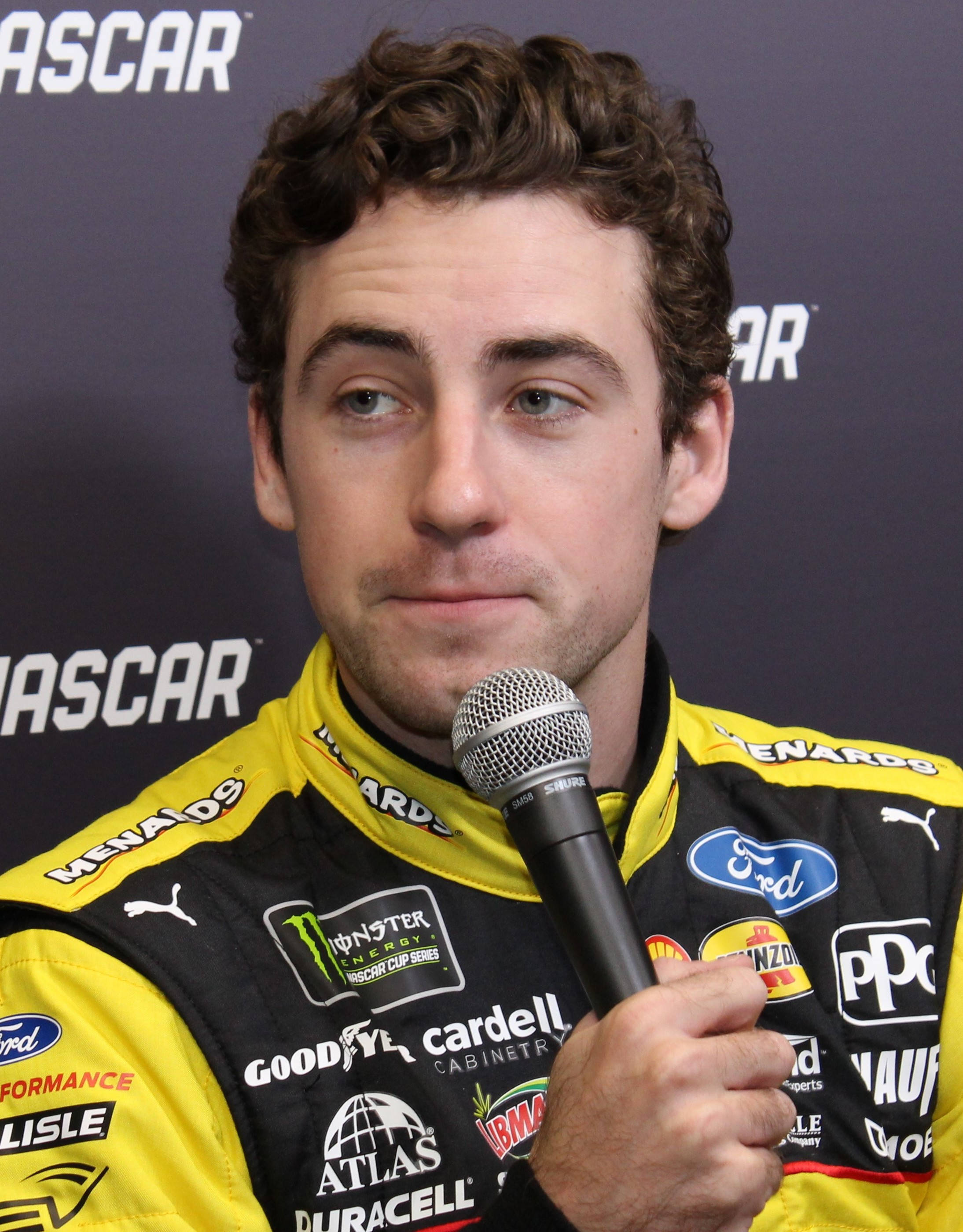Ryan Blaney, yellow and black racing suit, microphone, 2K Phone Wallpaper